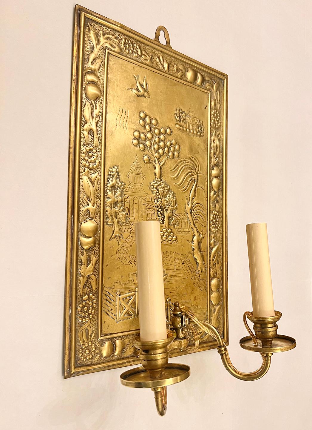 Pair of circa 1920's English repousse Chinoiserie sconces with 2 candelabra lights.

Measurements:
Height: 16.25