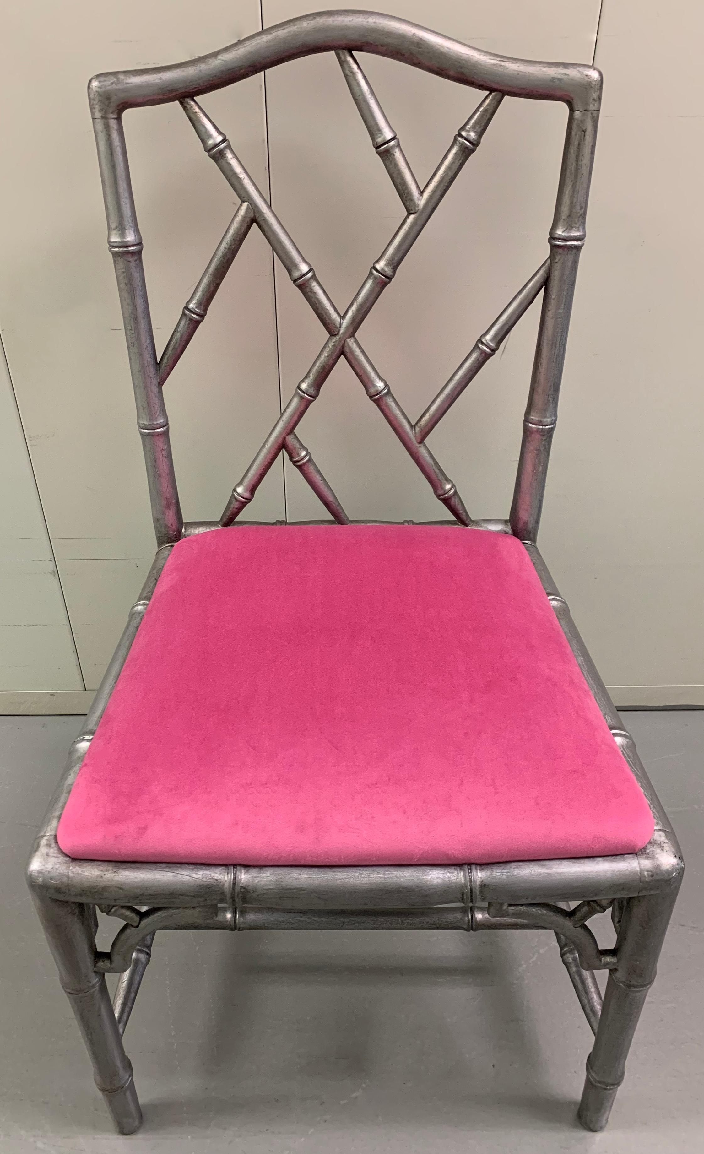 Pair of silver faux bamboo side chairs. Newly repainted in a dark silver finish. Newly upholstered in pink velvet by Duralee. Seat is 18.5