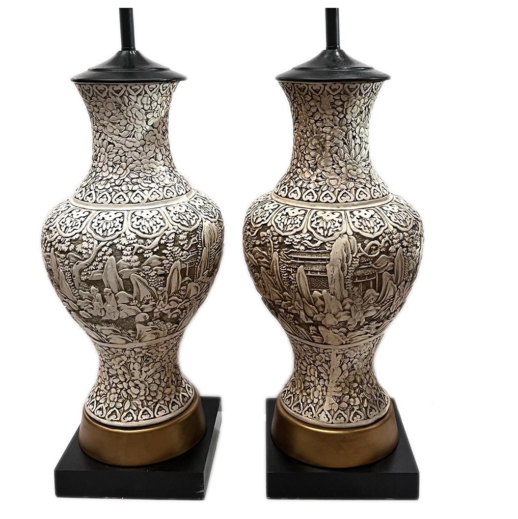 Pair of circa 1950's chinoiserie style carved plaster table lamps.

Measurements:
Height of body: 22.5