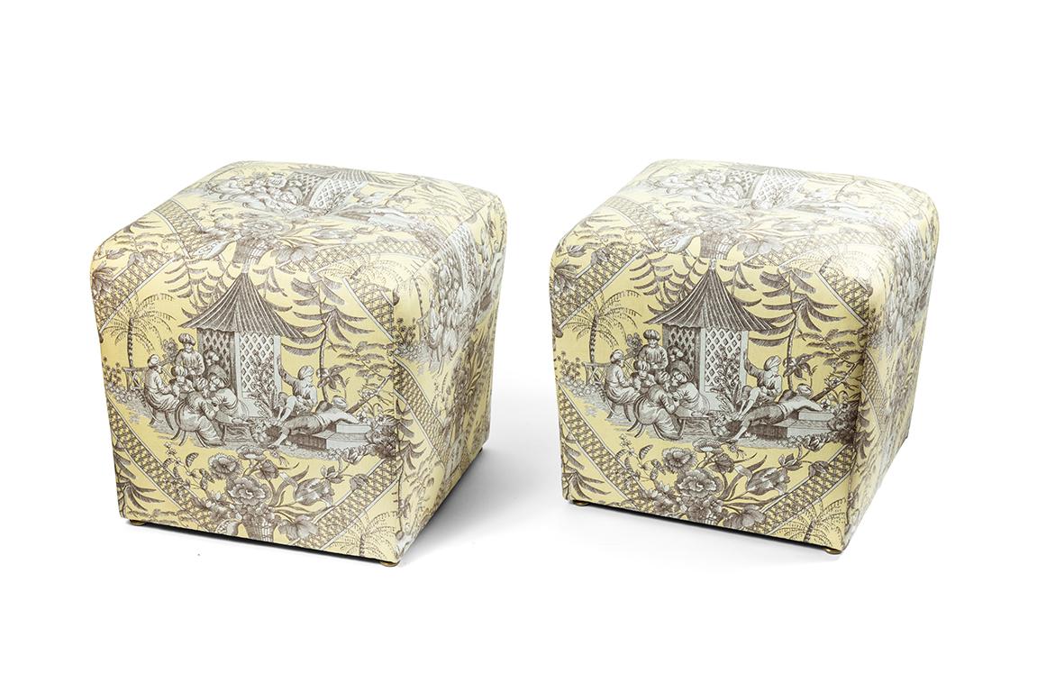 Vintage pair of ottomans covered in a Manuel Canovas toile fabric.