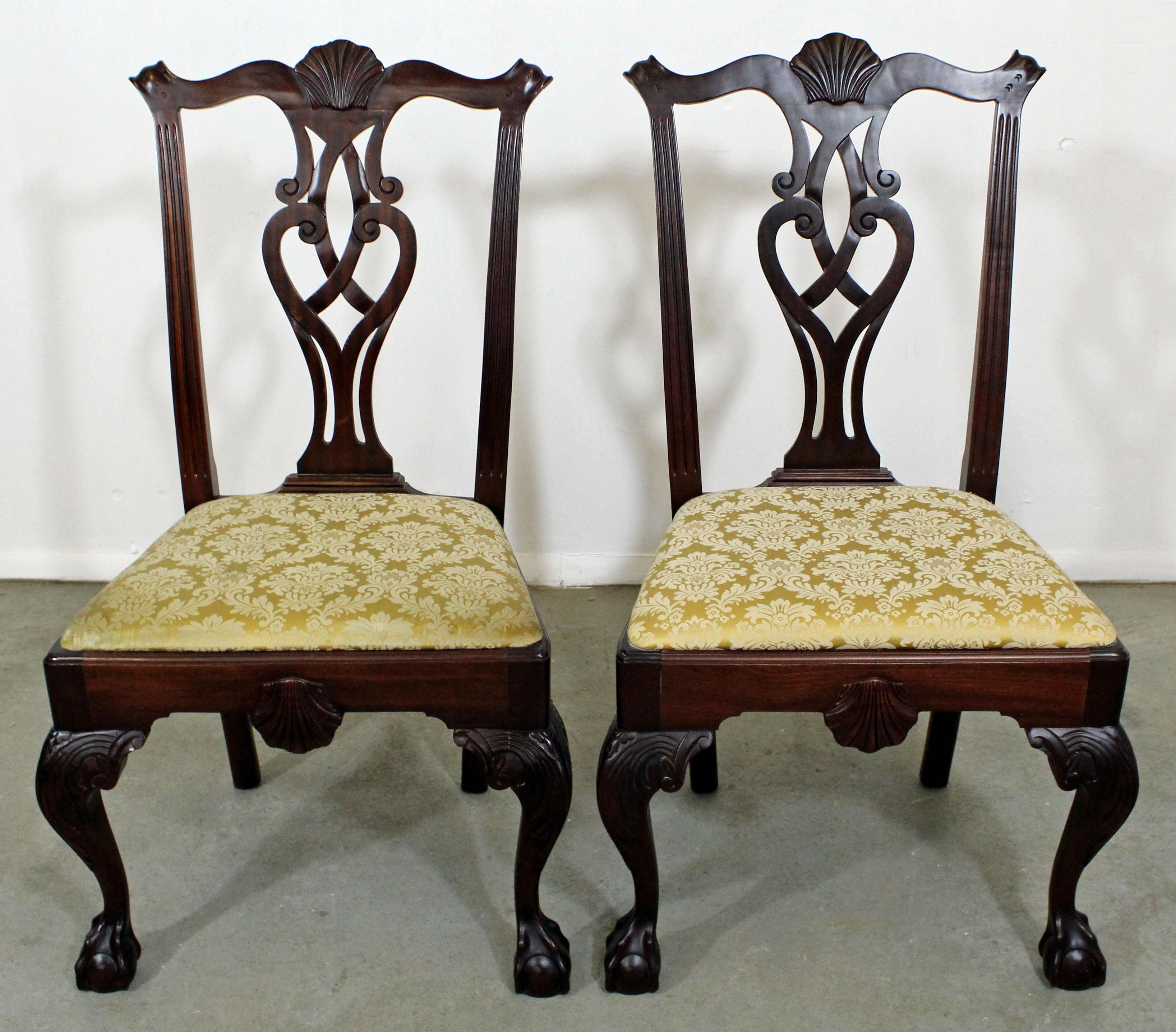 Offered is a pair of Chippendale mahogany dining chairs with ball and claw feet. They are in good condition, minus some slight age wear, need to be reupholstered. A great set to add to your home. They excellent quality and marked 'Made in Italy' but