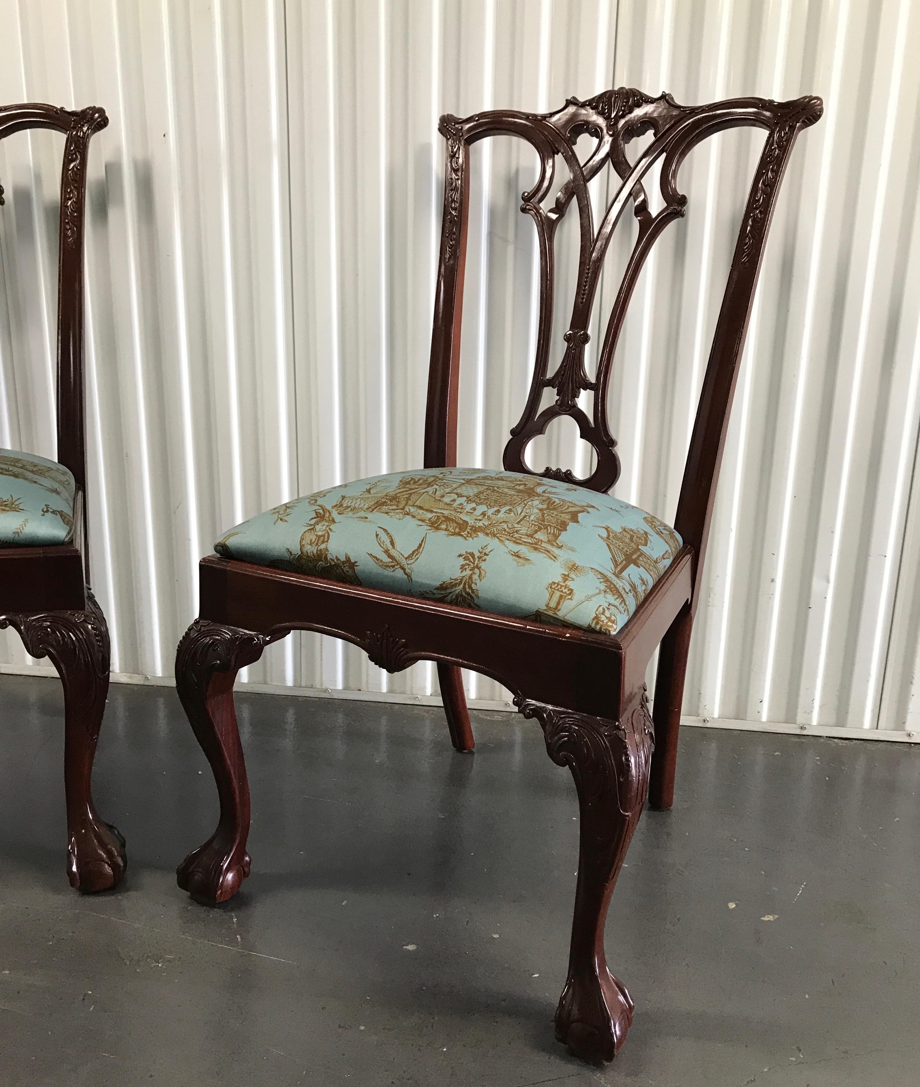 Pair of Chippendale style side chairs with chinoiserie toile fabric seats.
