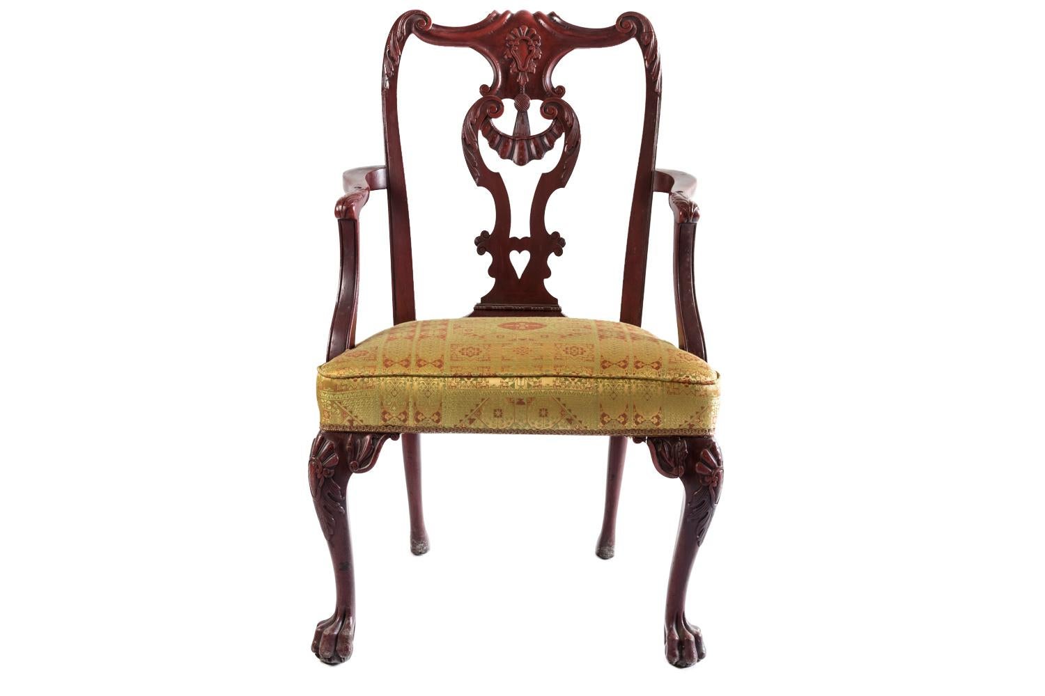 Pair of Chippendale style armchairs in red lacquered wood standing on four legs: cabriole front legs with a decor of cartouche, foliage and shell, claw and ball feet. Sabre back legs ending with simple shoes. Arm support behind the leg line, S-shape