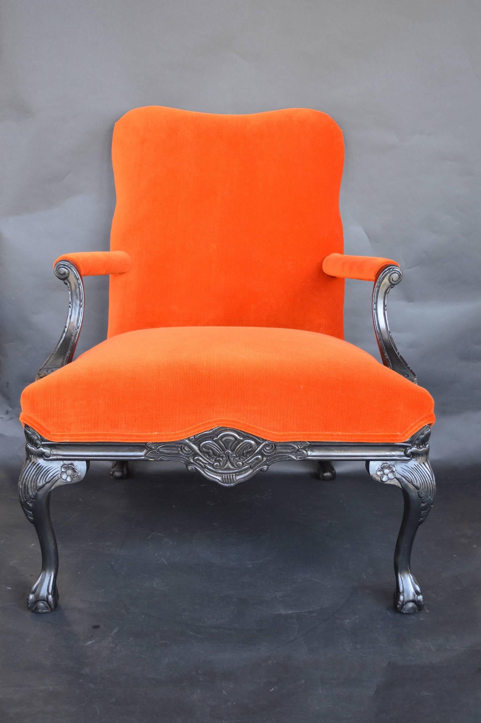 Pair of Chippendale style chairs. Upholstered in an orange corduroy. Black paint.