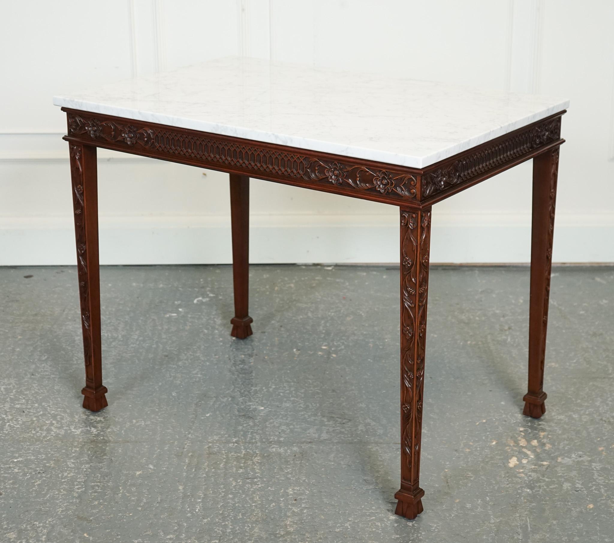 
We are delighted to offer for sale this Pair Of Chippendale Style Console Tables White Carrara Marble.

A pair of Chippendale style console tables with white Carrara marble tops is a stunning addition to any home. These tables are meticulously