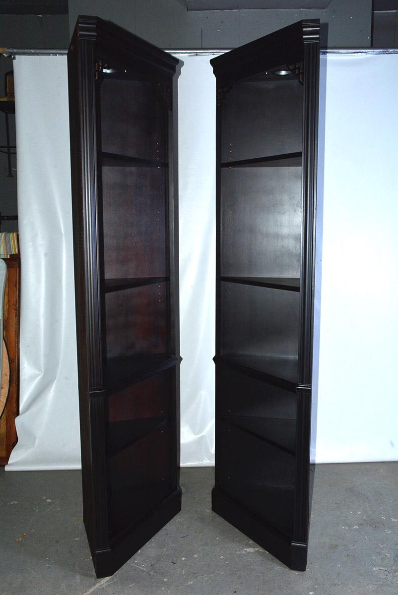 Useful pair of contemporary Chippendale style ebony black corner shelves each with five triangular shelves that can hold dishes in the dining room or kitchen, a clock and books in the den or family room or toiletries in the bathroom or books and