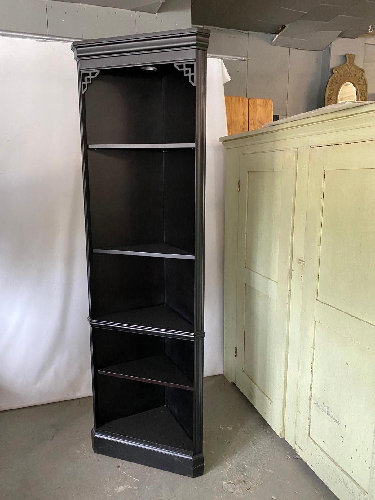 Useful pair of contemporary Chippendale style ebony black corner shelves each with five triangular shelves that can hold dishes in the dining room or kitchen, a clock and books in the den or family room or toiletries in the bathroom or books and