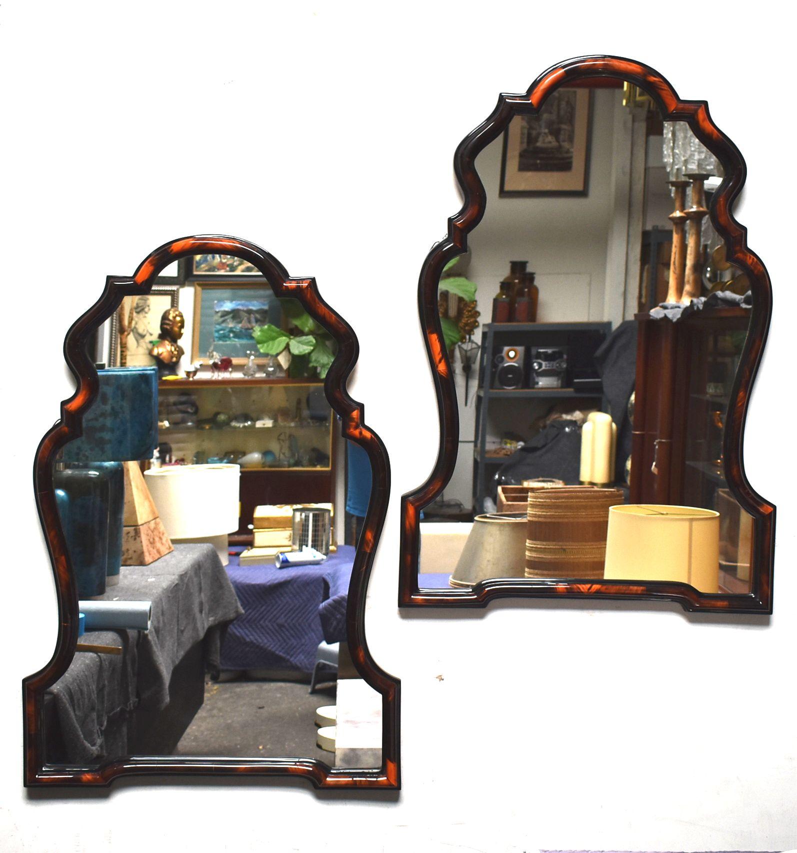 Pair of mirrors cover with red horn and high gloss polyester resin filled finish.

Additional dimensions of mirror frame:
Width top 23 inches
Width middle 28 inches
Width bottom 30 inches.