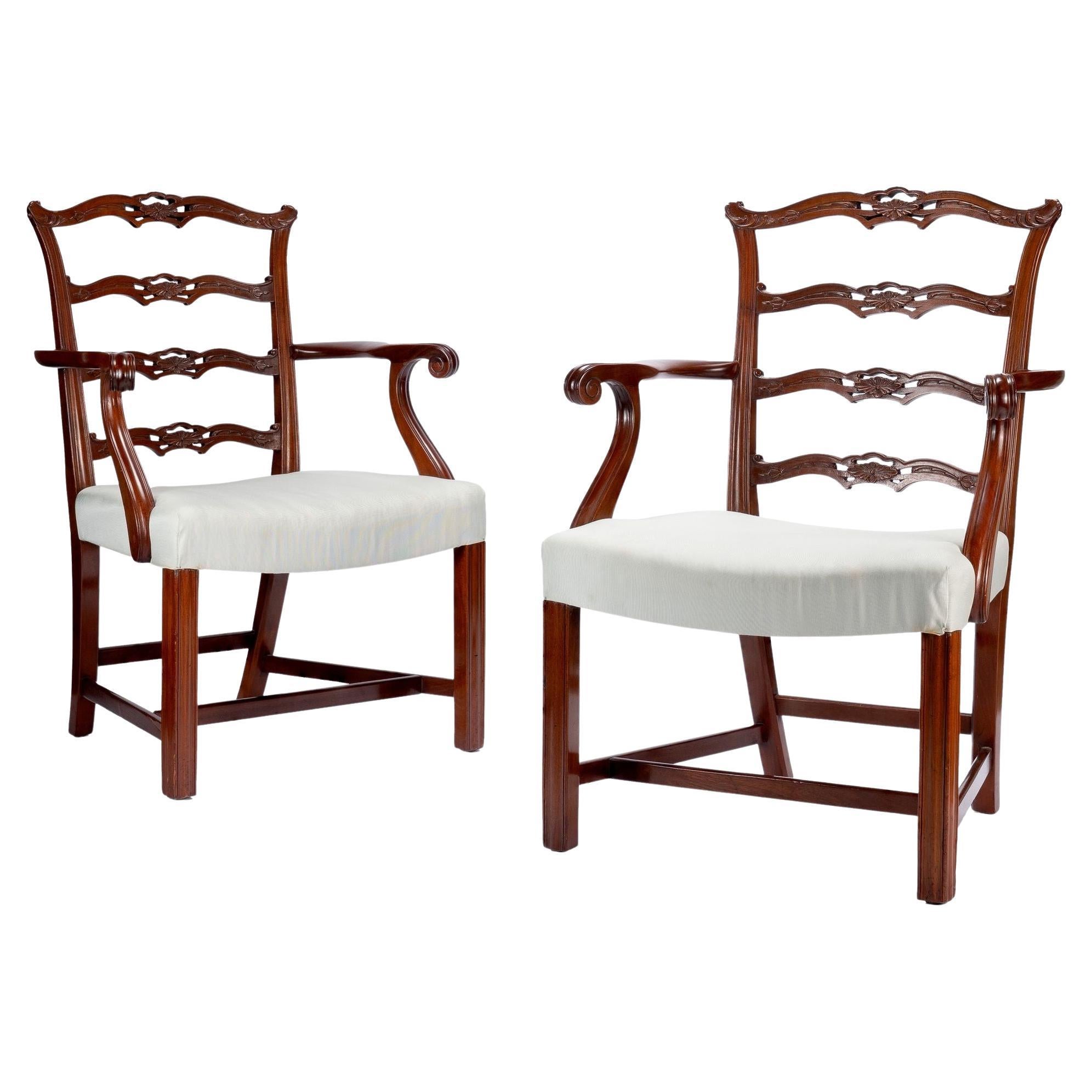 Pair of Chippendale style ladder back arm chairs, c. 1930-40 For Sale