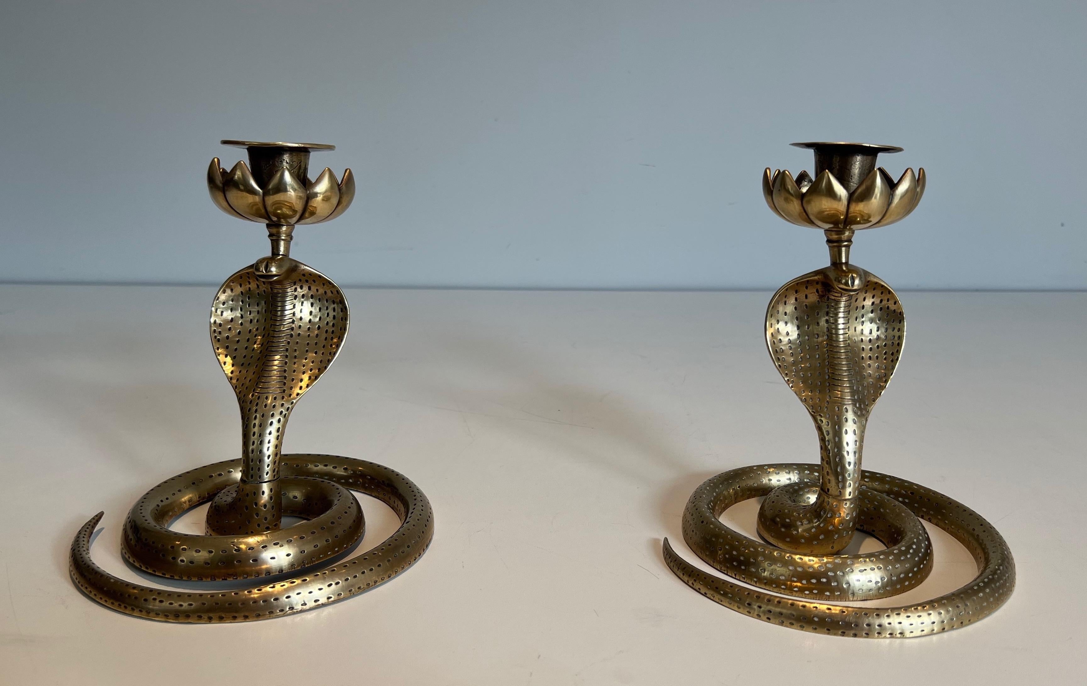 This very nice pair of cobra candlesticks is made of a finely chiseled bronze. This is a French work. Circa 1940