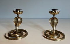 Pair of Chiseled Bronze Cobra Candlesticks