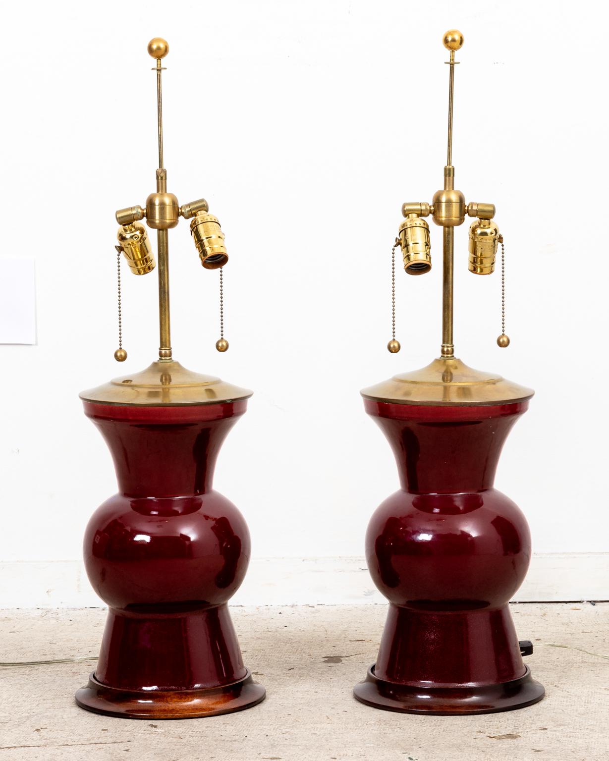 Circa 20th century pair of large burgundy color vintage ceramic 