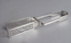 Par de pinzas para picar carne fabricadas en Londres por George Adams, 1854