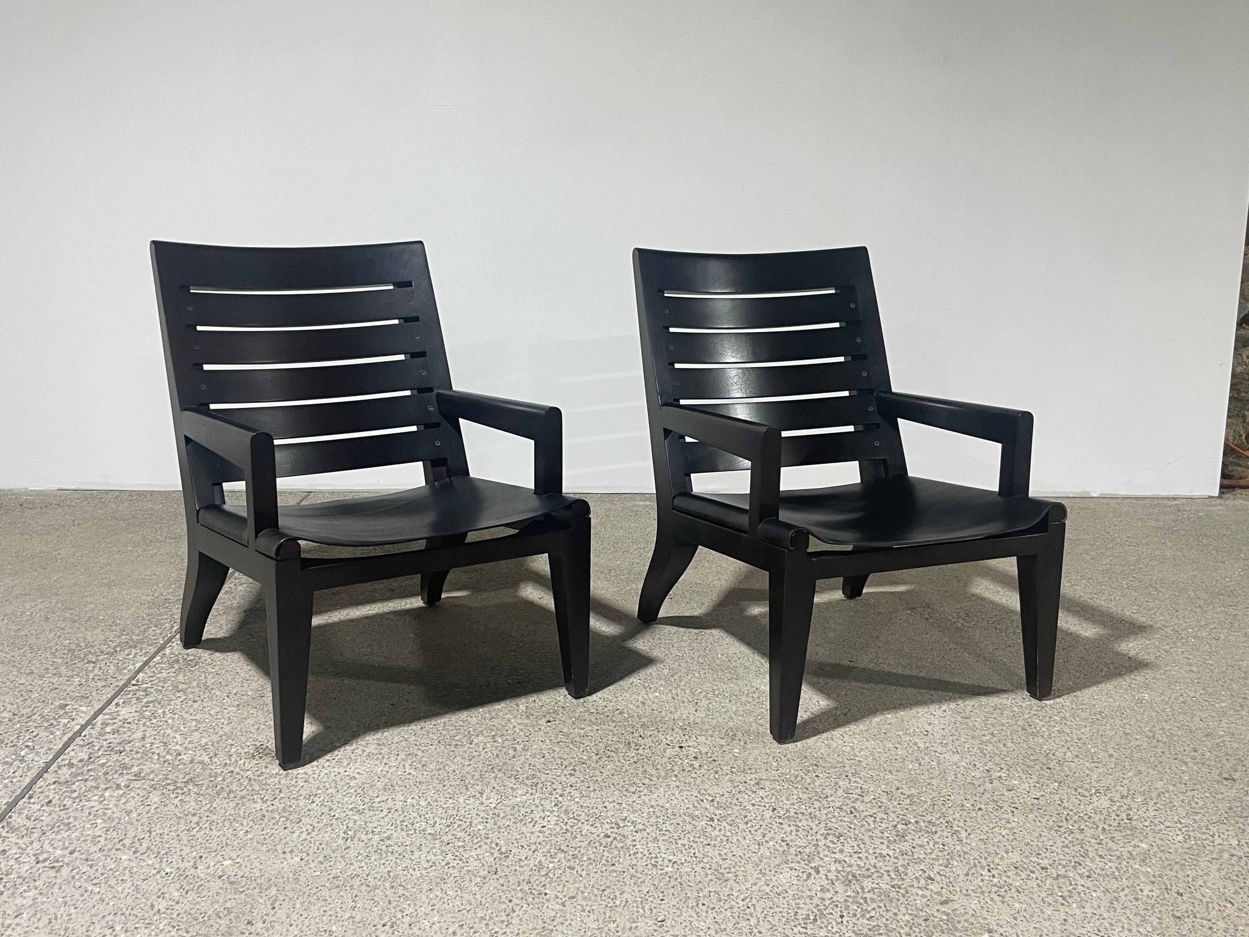 Designed by Christian Liaigre for Holly Hunt.

Very comfortable and supportive. 

Thick dark espresso wood frame with leather sling seat.

These sophisticated chairs are marked with a manufacturer label. 

Originally over $10,000 for the set.