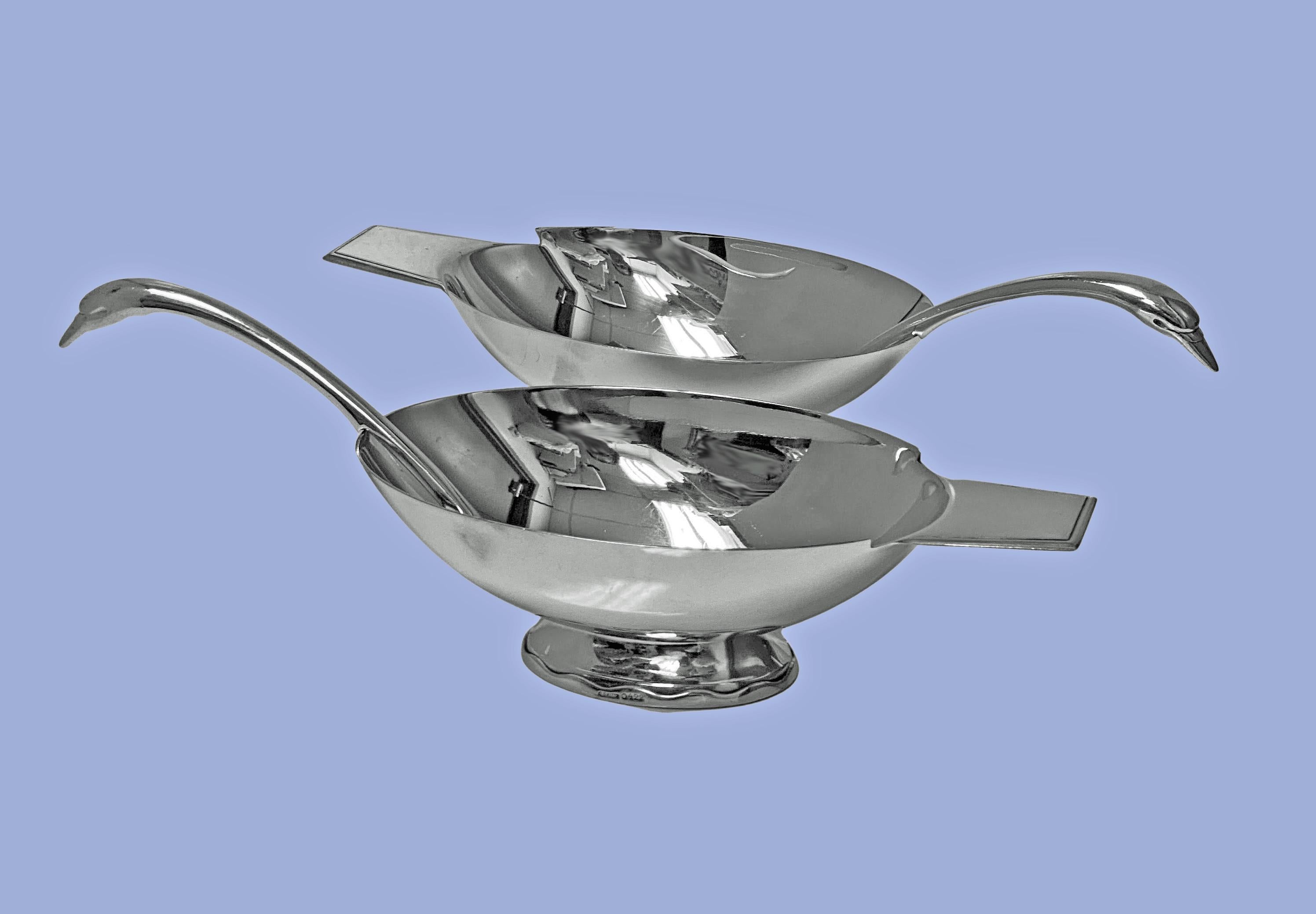 Pair of Christofle Art Deco silver plate sauceboats and ladles each conforming to the shape of a swan, designed by Christian Fjerdingstad for Christofle, France. C. 1935. The Sauceboats on oval shaped footed bases with wavy design motifs, plain oval