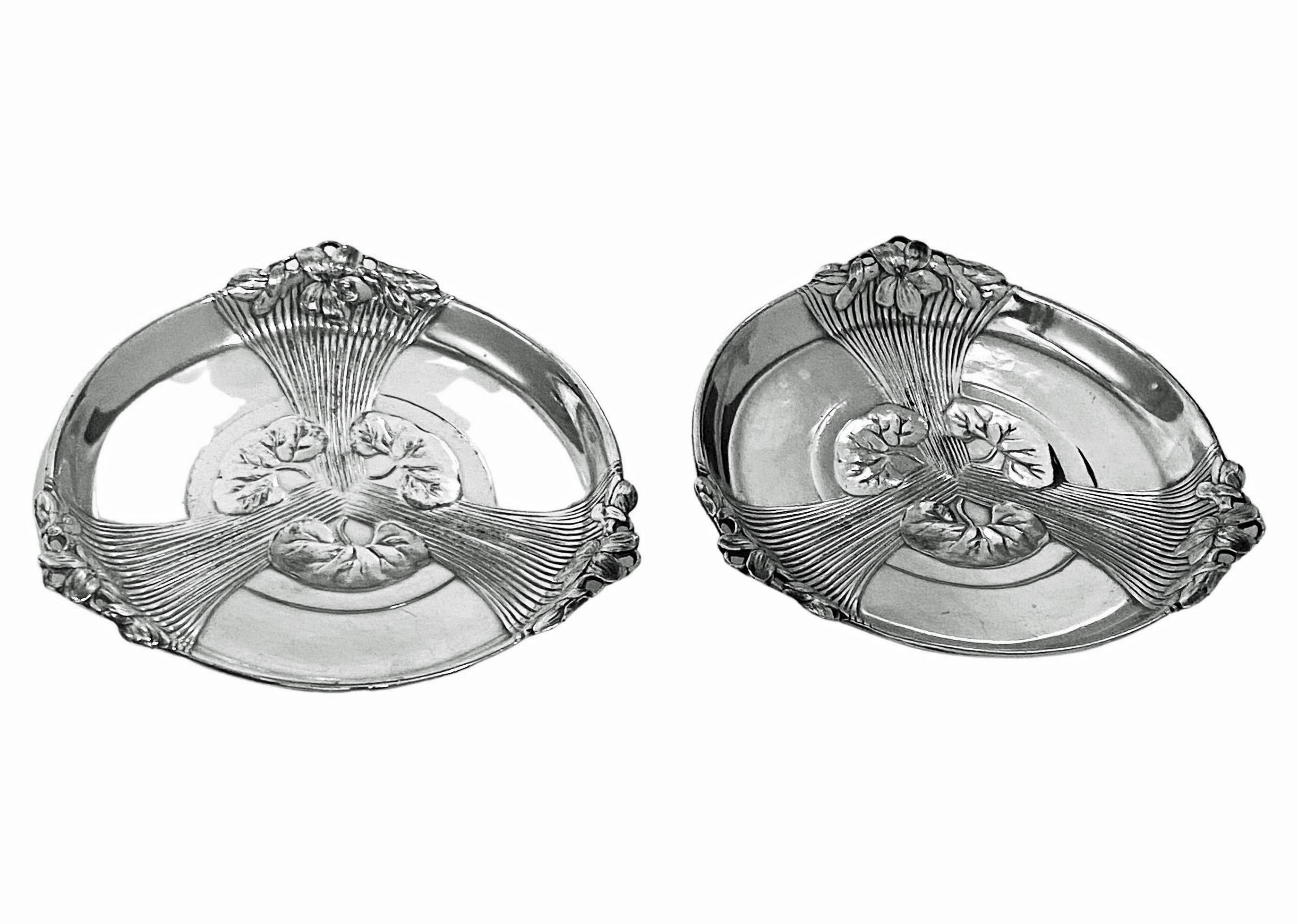 Pair of Christofle Art Nouveau Wine Bottle Holders Coasters C.1910. Stylised Art Nouveau silver plate coasters in remarkable condition for the age. Rare to find this design. Fit any size bottles and bottles lie flat. Diameter: 5.50 inches. Height: