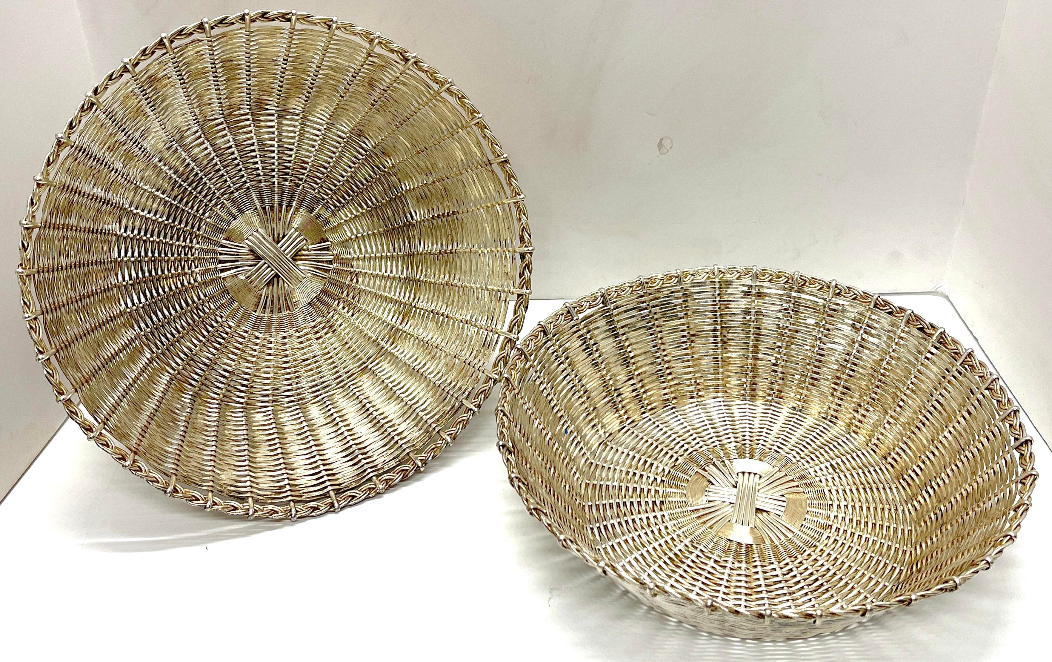 Pair of Christofle ( Atrib.) Silverplated woven baskets, each one of circular form with hundreds of woven silverplated hand-woven strands. Unmarked.
Each basket has a 12