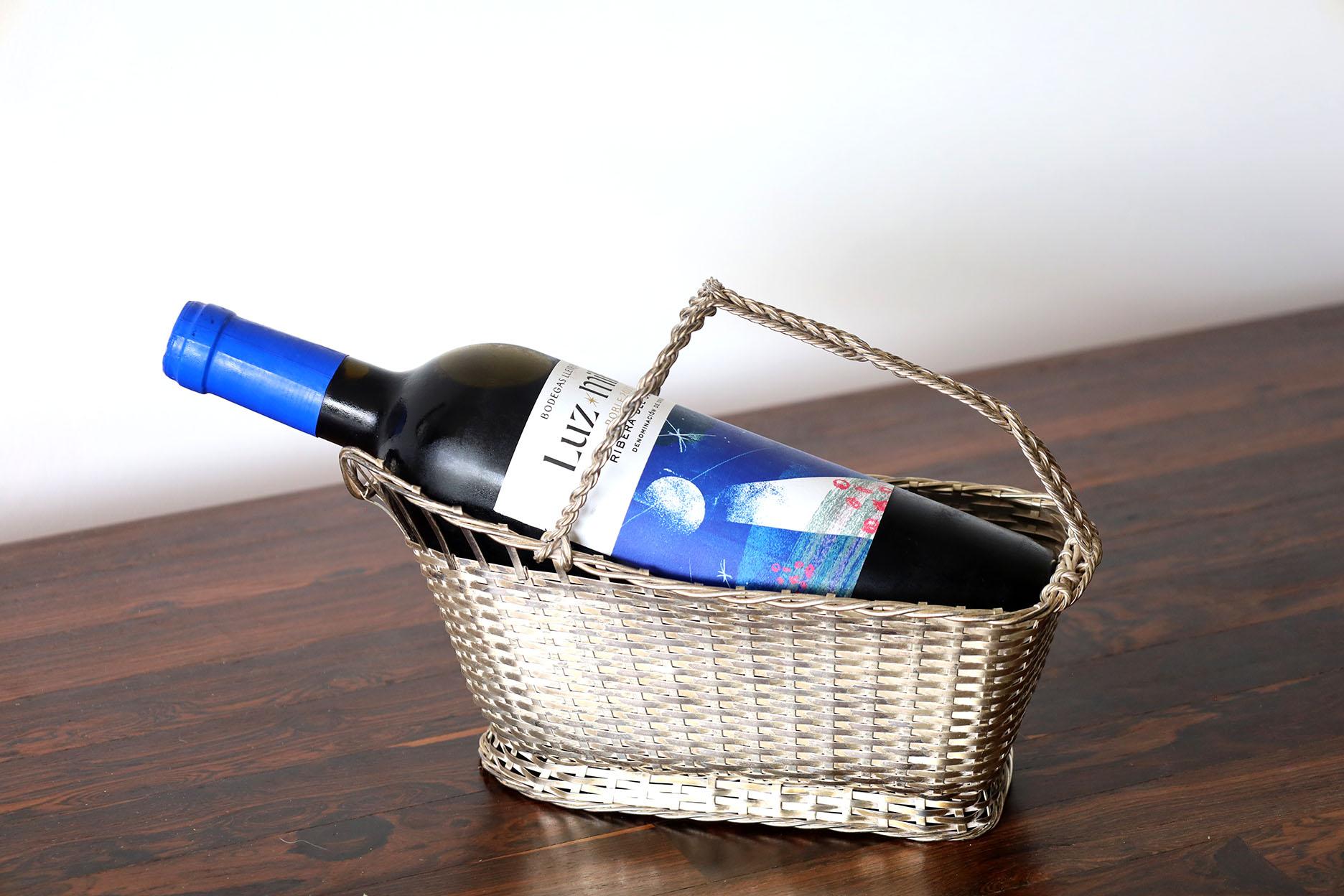 Pair of Christofle France silver-plated bottle holder 'Gallia' by Lino Sabattini 

 Lino Sabattini
(1925-2016), Italian goldsmith and designer.
20th Century  Grand French silver-plated --  FRENCH CLASSIC ART DECO ERA LOOK - WINE BOTTLE HOLDER
