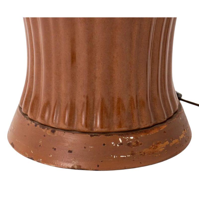 A pair of vintage chocolate brown ceramic table lamps, possibly from Christopher Spitzmiller.  Ribbed and shaped chocolate lamps, each have two lights with chain pulls.  Recenly rewired. Lamp shades are sold separately