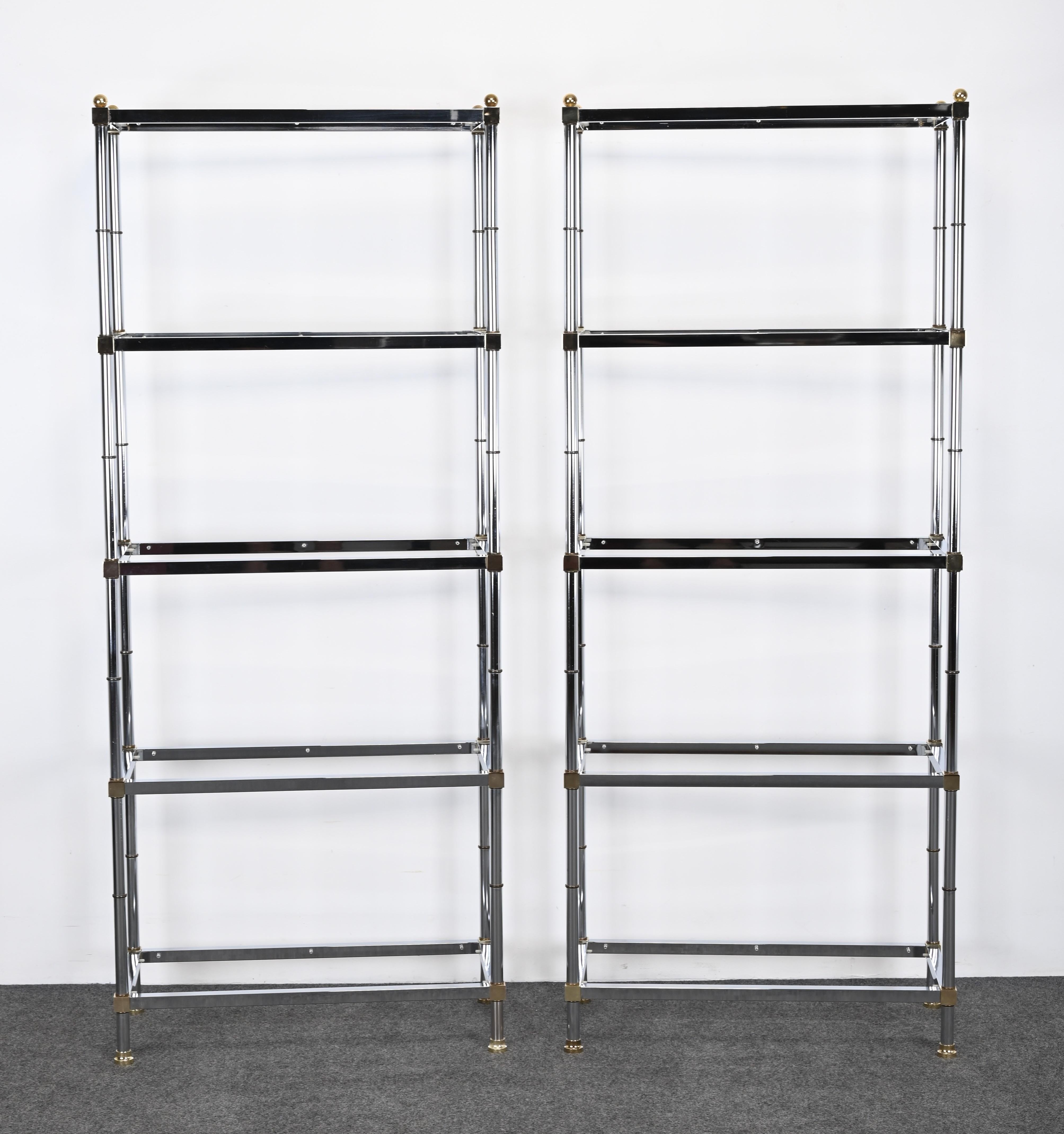 A pair of stylish Mid-Century Modern Chrome and Brass Etageres or Shelves in the manner of D. I. A. Below we have described the company that most represents these pieces, however, they are not labeled D. I. A.  The shelves are very functional. There