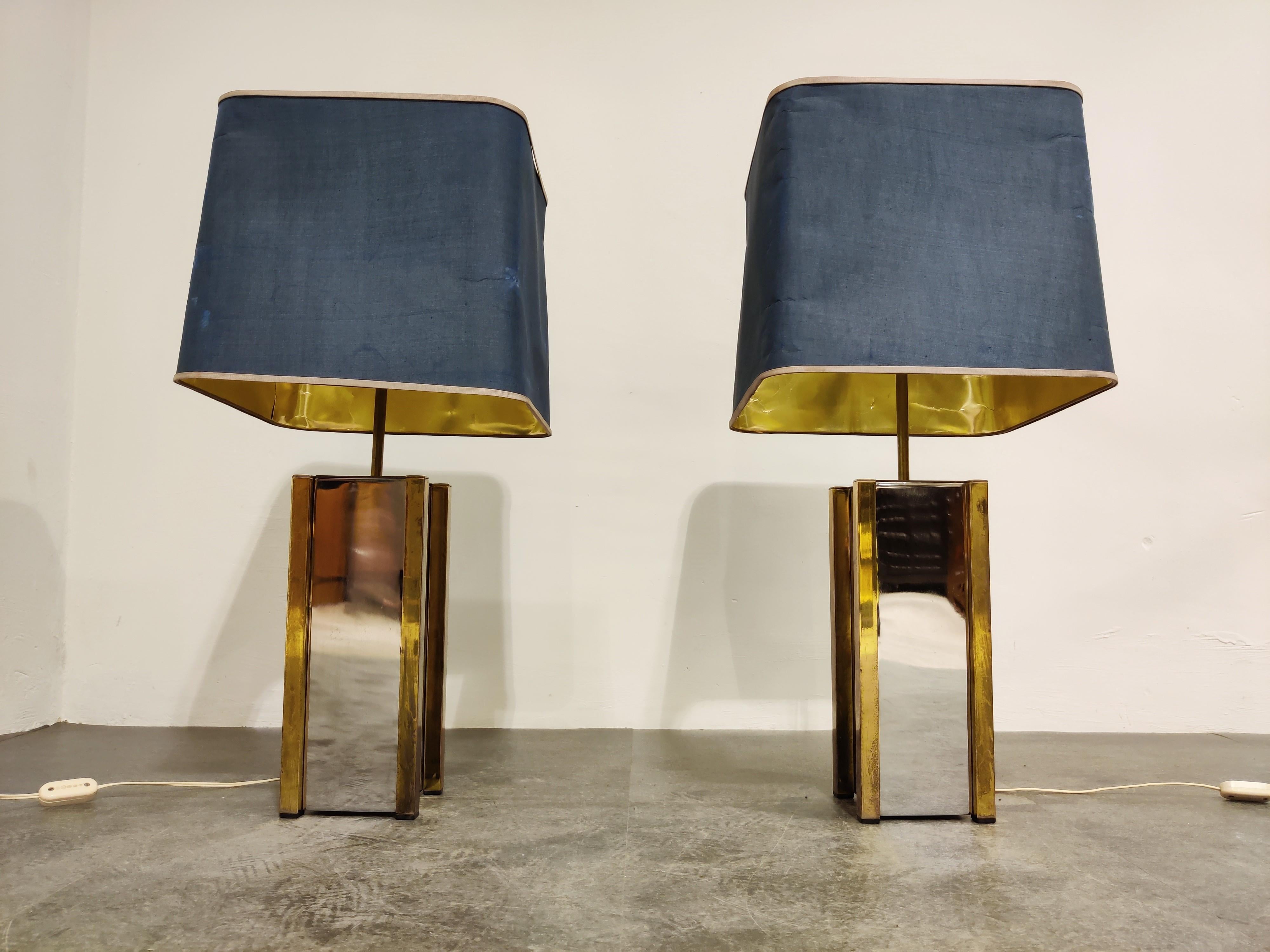 Pair of large brass and chrome table lamps by Belgochrom. 

Seventies glamour.

Come with their original slightly battered lamp shades.

We can supply’s custom lamp shades on demand.

The length of the rod can be adjusted.

Tested and