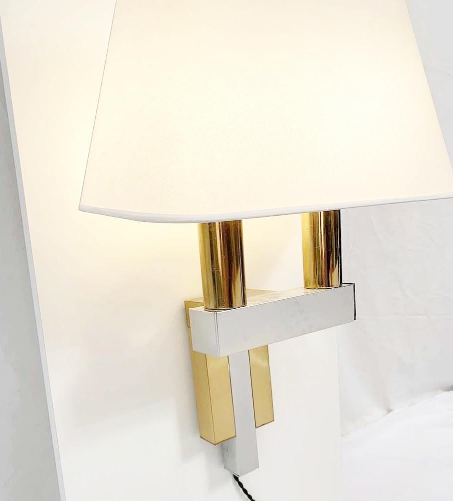 Pair of chrome and brass wall lights in the style of Willy Rizzo, 1970s - 21 pairs available.