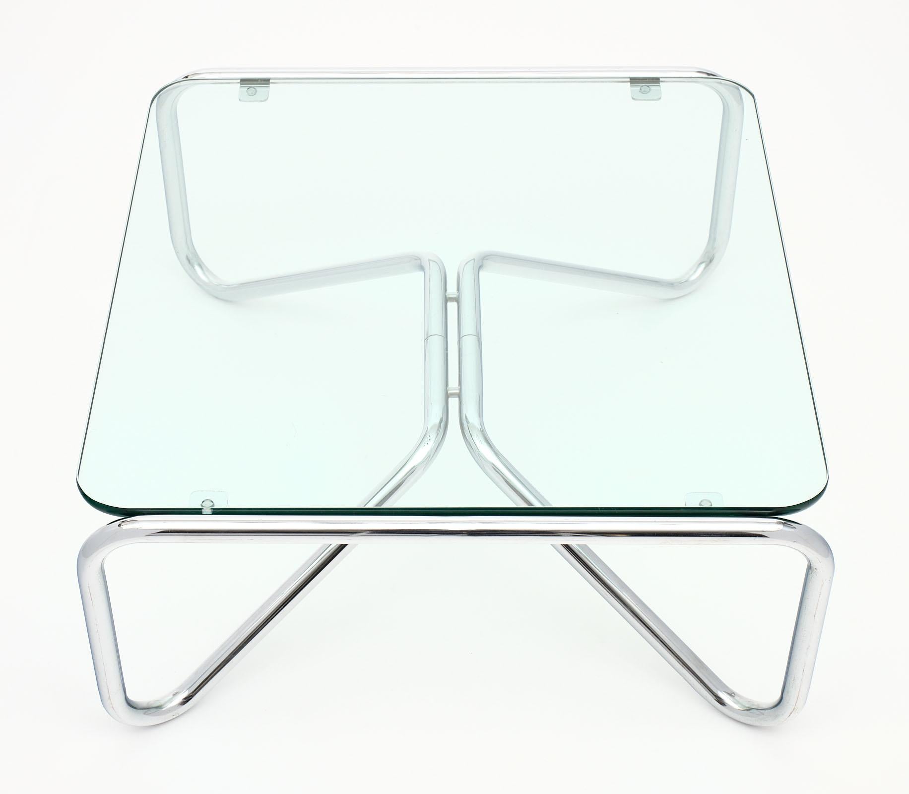 Pair of chrome and glass coffee tables with tubular chrome structures and glass slabs in great condition. We love the clean lines and impressive feel these tables bring to a space.