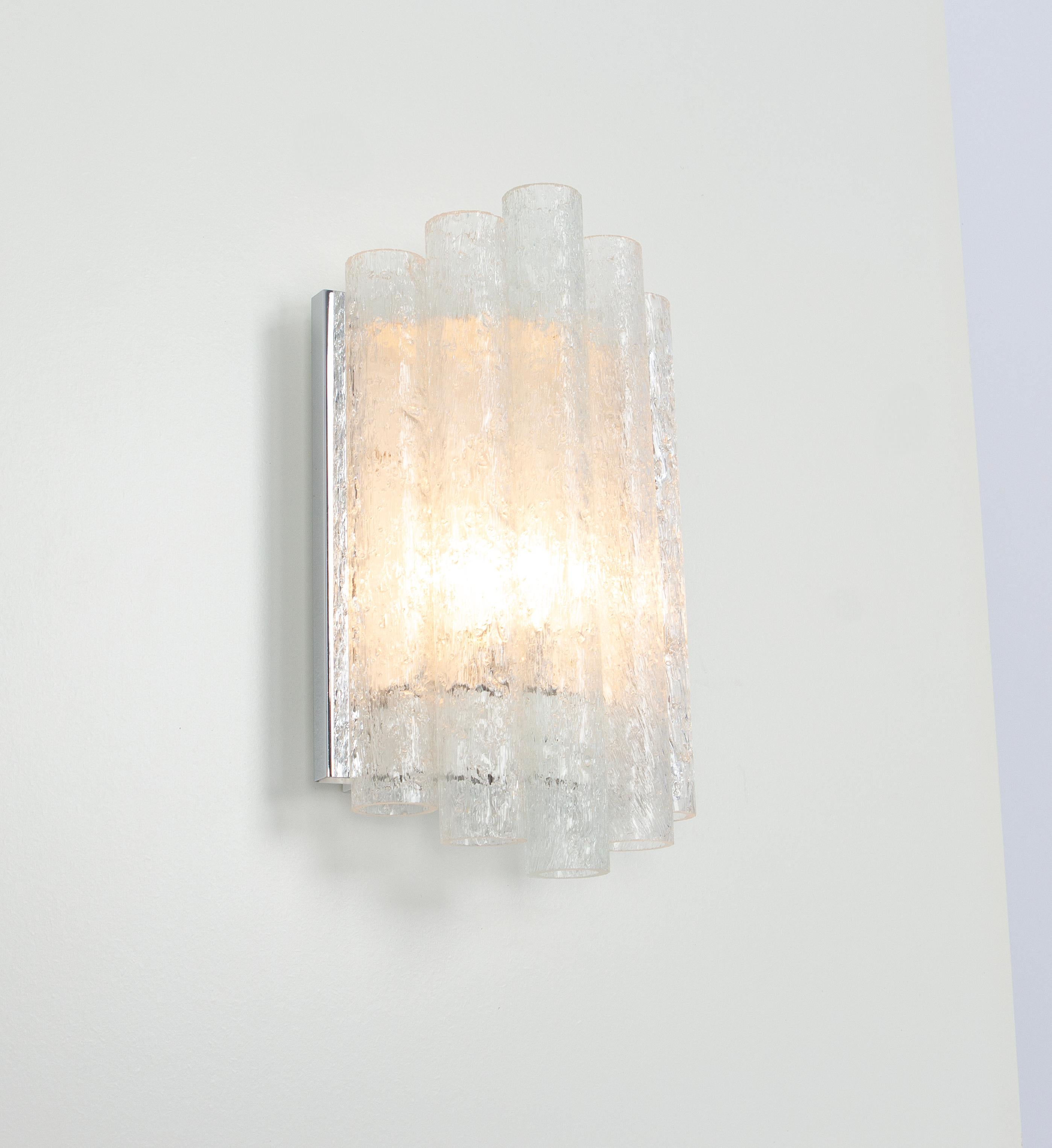 Pair of  Wonderful mid-century wall sconces with ice glass tubes, made by Doria Leuchten, Germany, manufactured, circa 1960-1969.

High quality and in very good condition. Cleaned, well-wired and ready to use. 

Each sconce requires 1 x E14 small