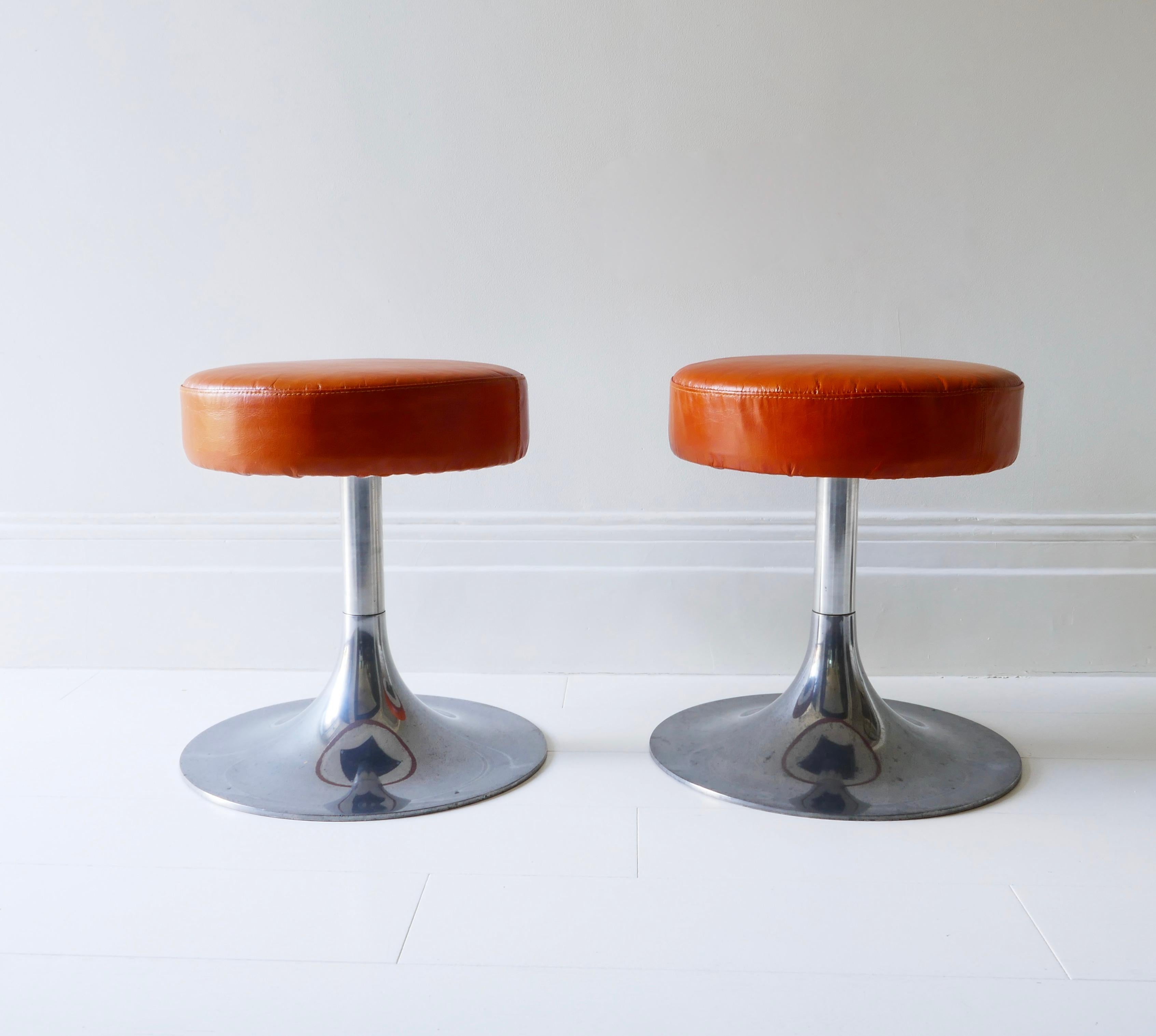 Pair of chrome and orange leather stools with a nice patina, Italy 1970s.