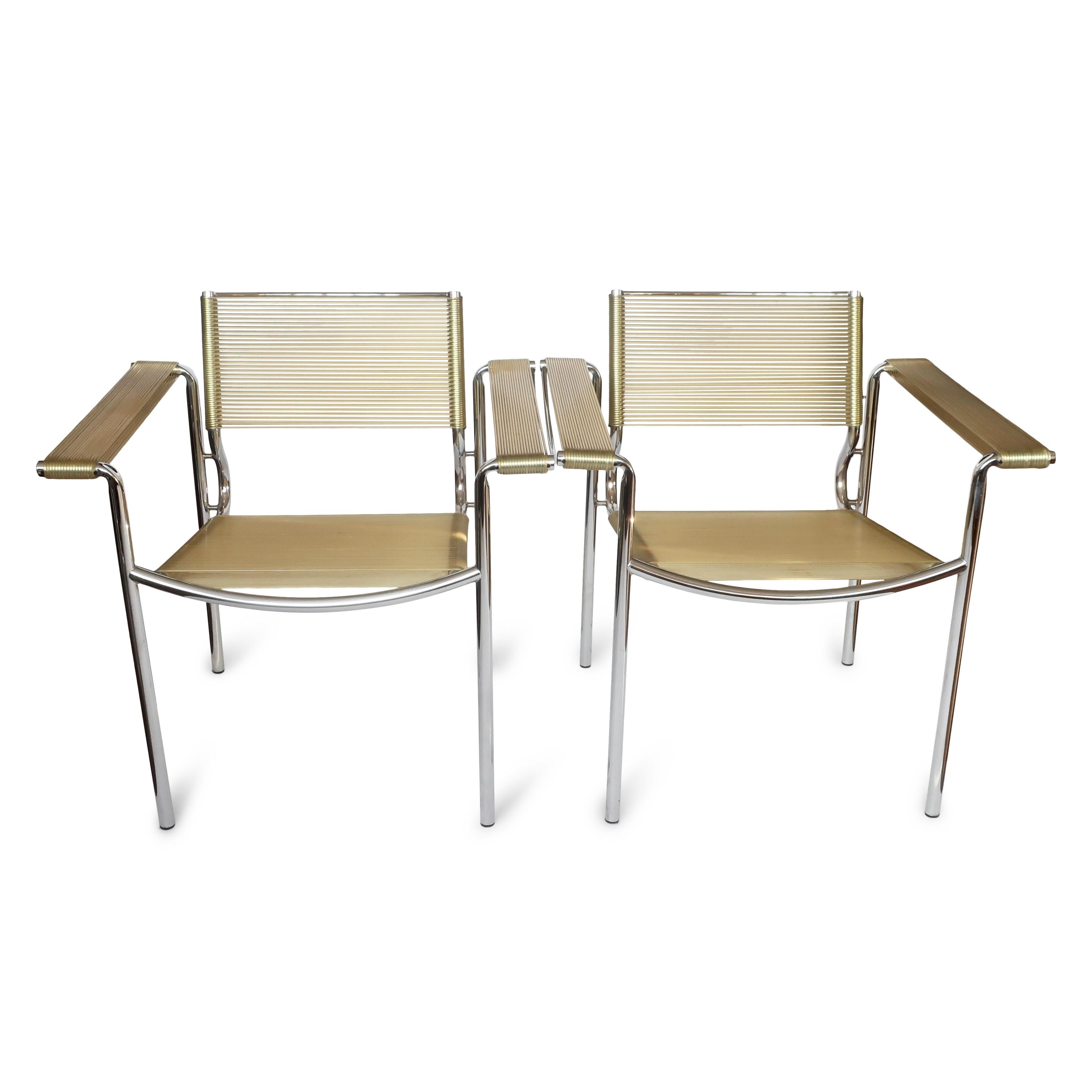 A pair of vintage Alias 109 Spaghetti armchairs with tan seat, back, and arm rests on a chrome frame by Giandomenico Belotti.  A classic of modern design that can be found in the permanent design collection of the MoMA, these are named for the