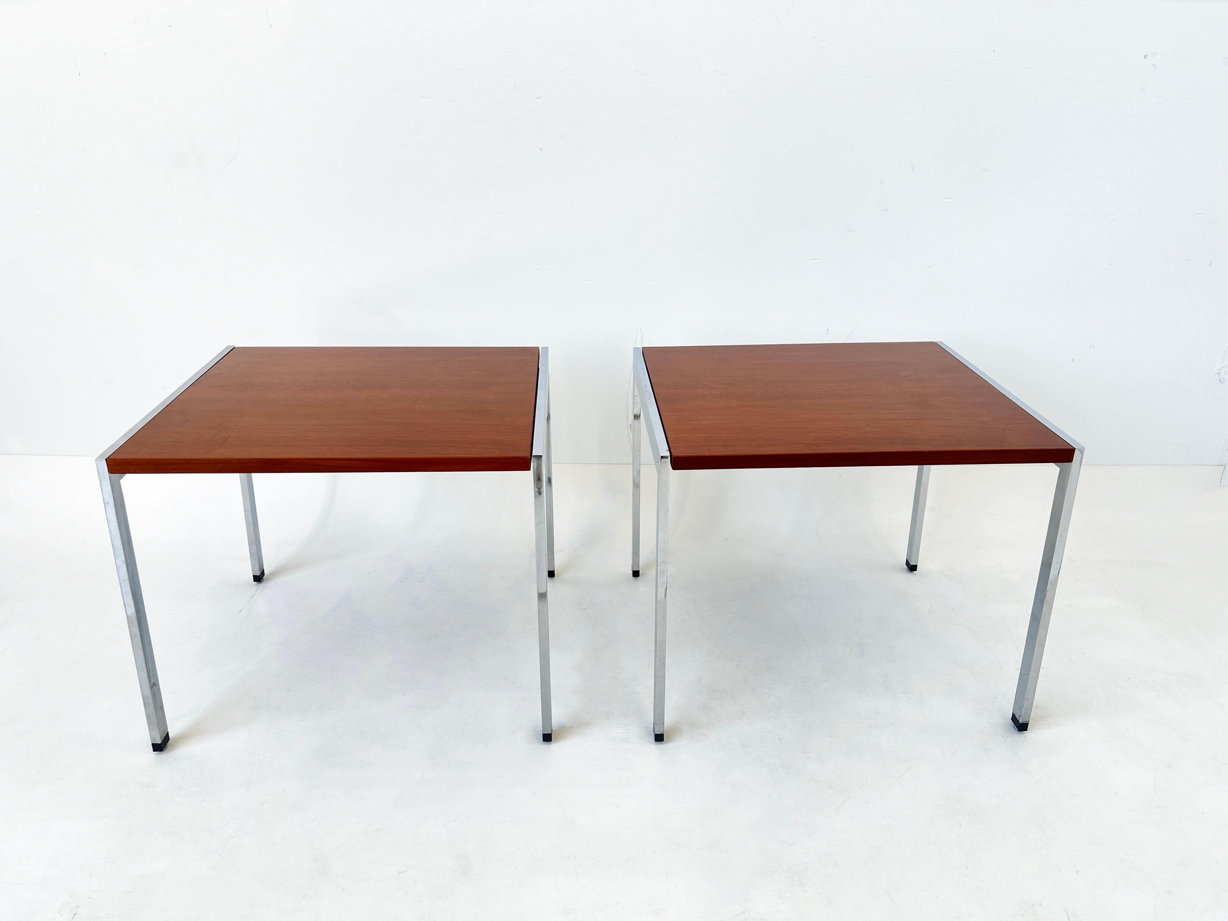 1980’s Pair of polish chrome and walnut side tables by Ward Bennett. 
In original vintage condition, the tops show minor wear consistent with age. 

Measurements: 20” wide 18” Deep. 16.5” High. 