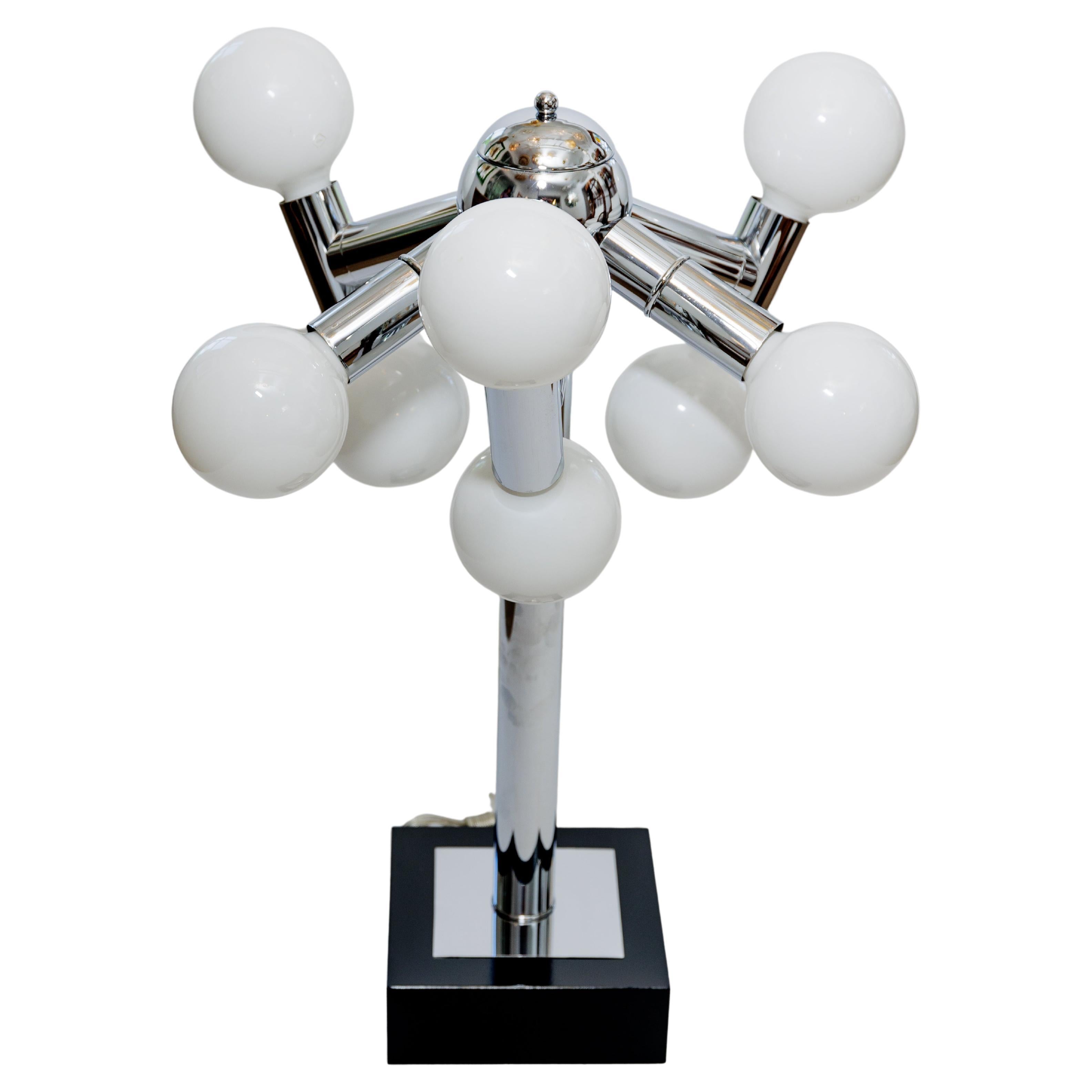 A pair of chrome black base table lamps, each with nine globes of light.