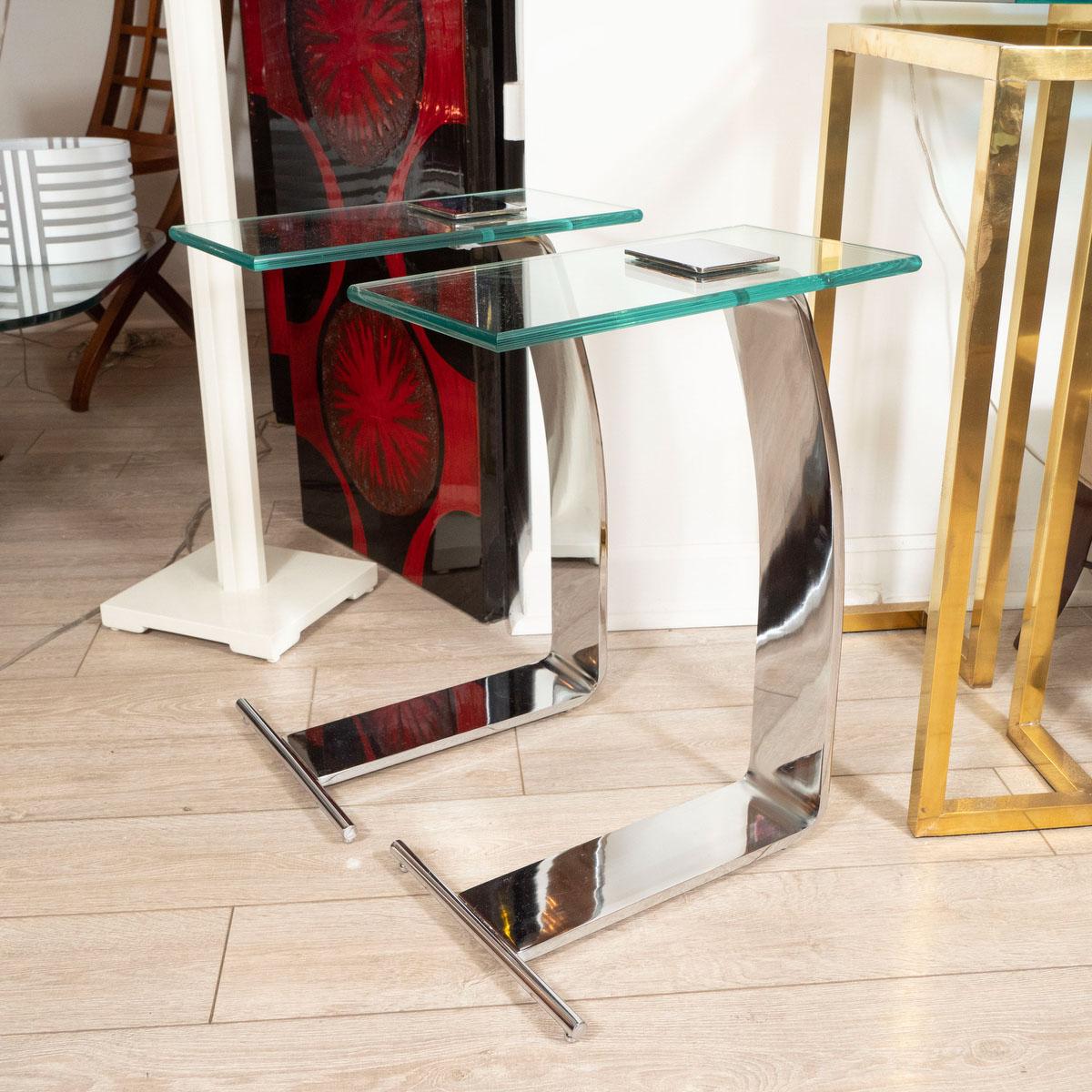 Pair of chrome side tables with glass tops. Model #431 by Marty Smith for Design Institute of America.