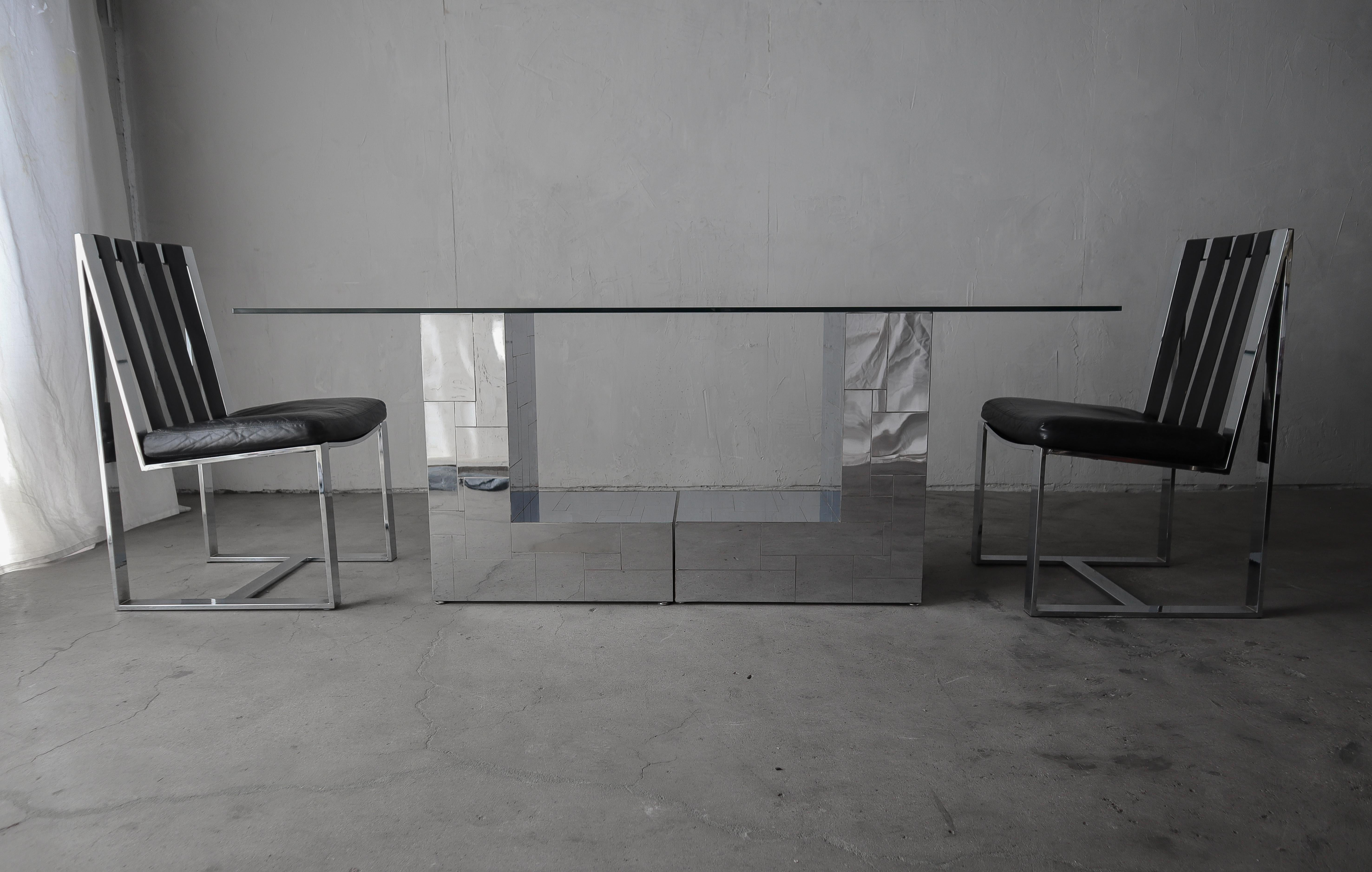 Seize the rare opportunity to own an authentic and rare chrome metal patchwork pedestal dining table by Paul Evans. Table is comprised of 2 L-shaped pedestals clad in chrome pieces laid in a patchwork design.  A perfect example of the uniqueness and