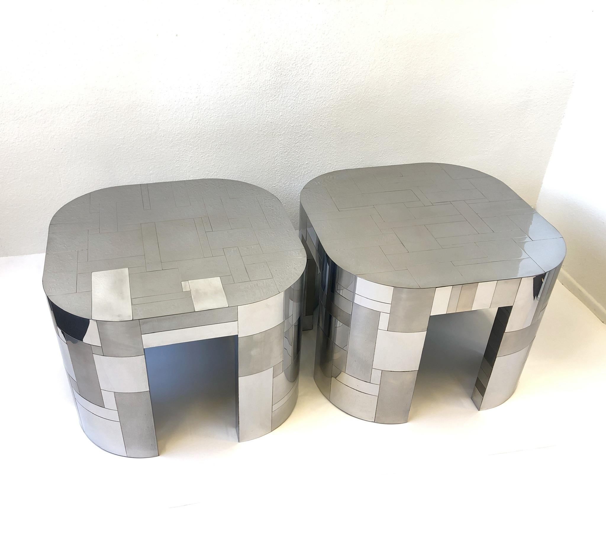A glamorous pair of polish and satin chrome side table from the Cityscape collection design by Paul Evans in the 1970s. Both tables have the Paul Evans signature. The tables came out of British tycoon Lord James Hanson Palm Springs estate.
