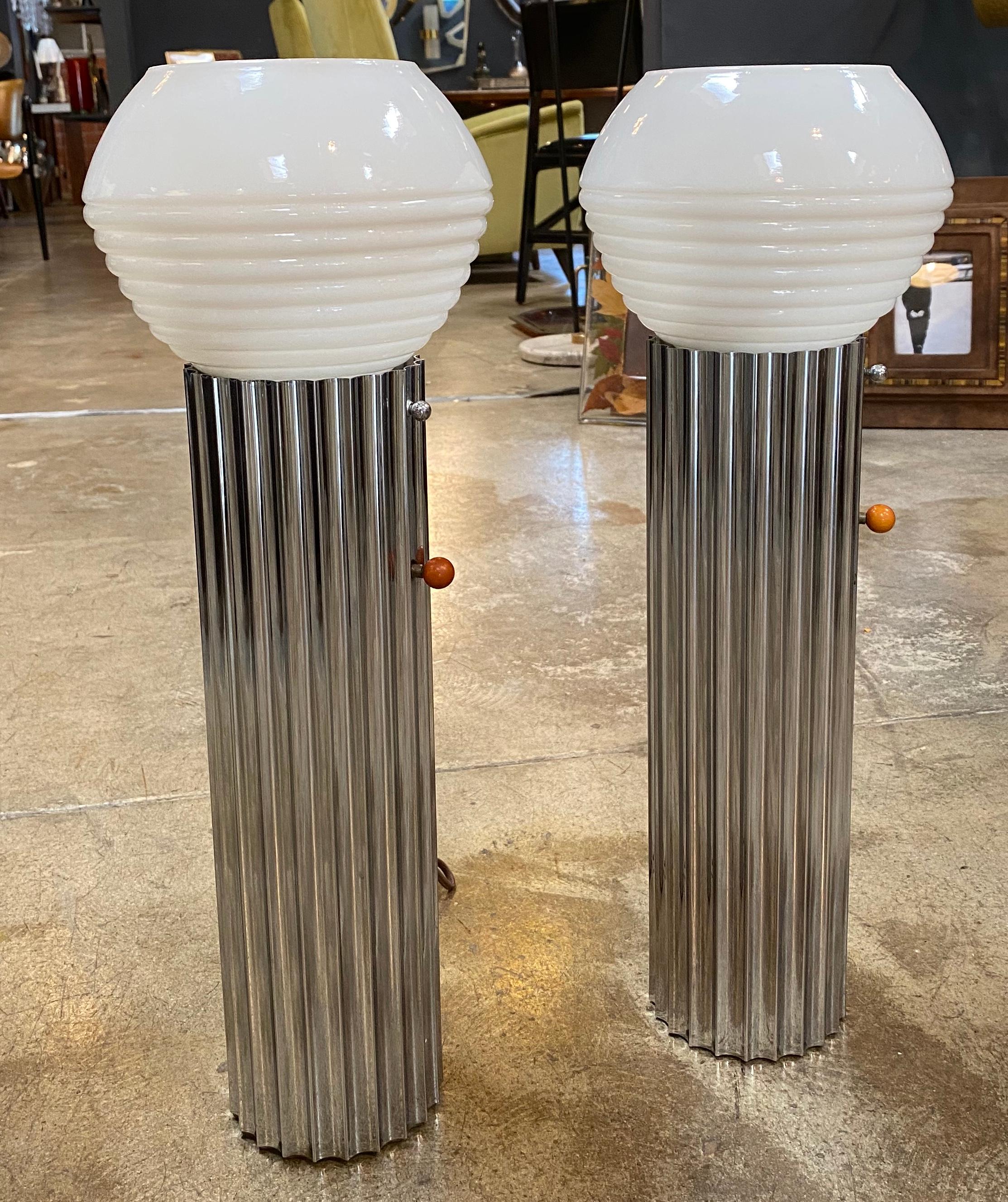 Stunning table lamps signed with the manufacturer's trademark embossed on the chrome base: [Nessen Studio N.Y.], 1930. Original chrome and glass globes, with original catalyst and chrome lampshade screw. These two lamps have a crazy design, their