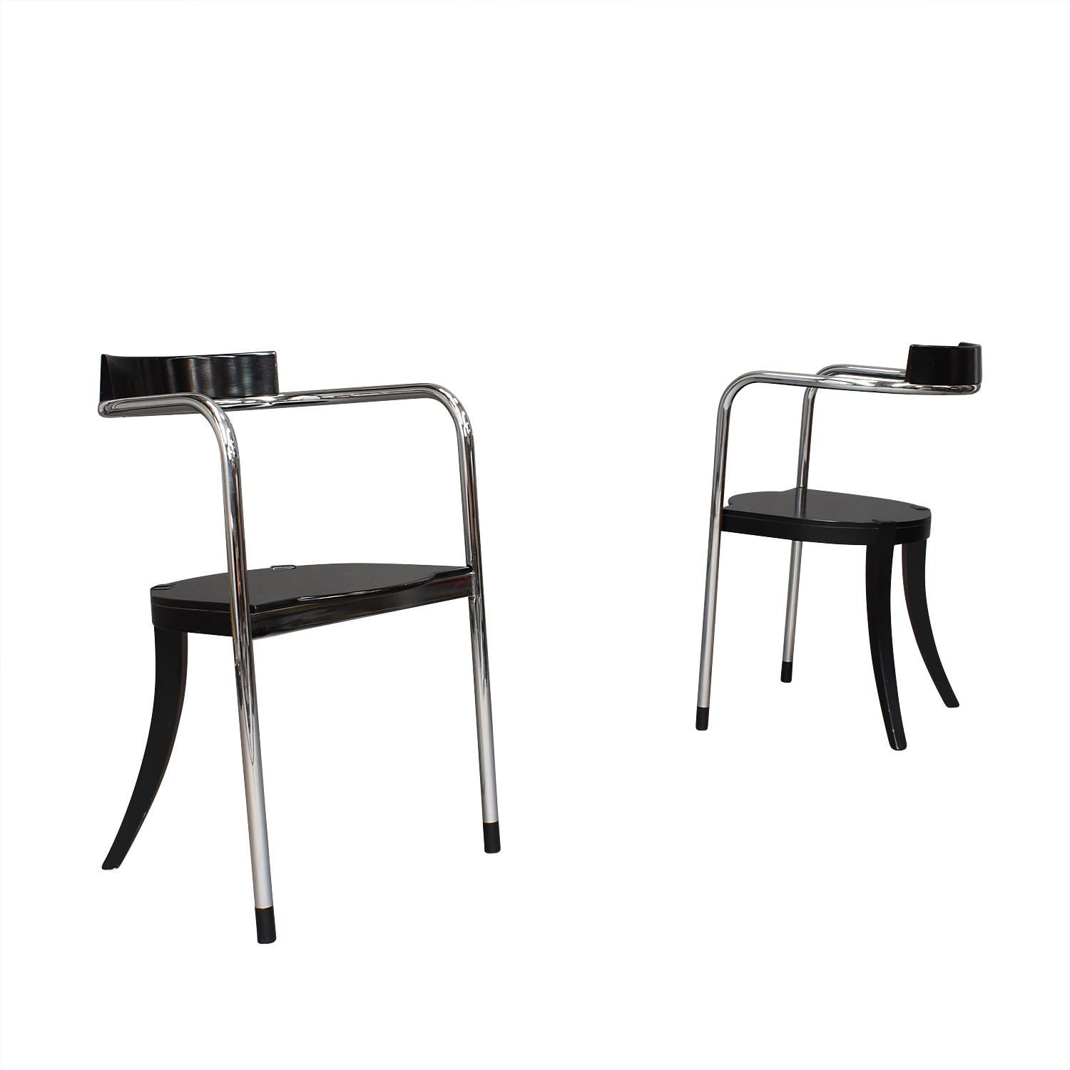 Artistic and stylish pair of side / dining chairs by David Palterer for Zanotta, Italy. The chairs are made in chromed tubular frame that features a floating backrest. The wood is made in the manor of original ebonized wood.

Designer: David