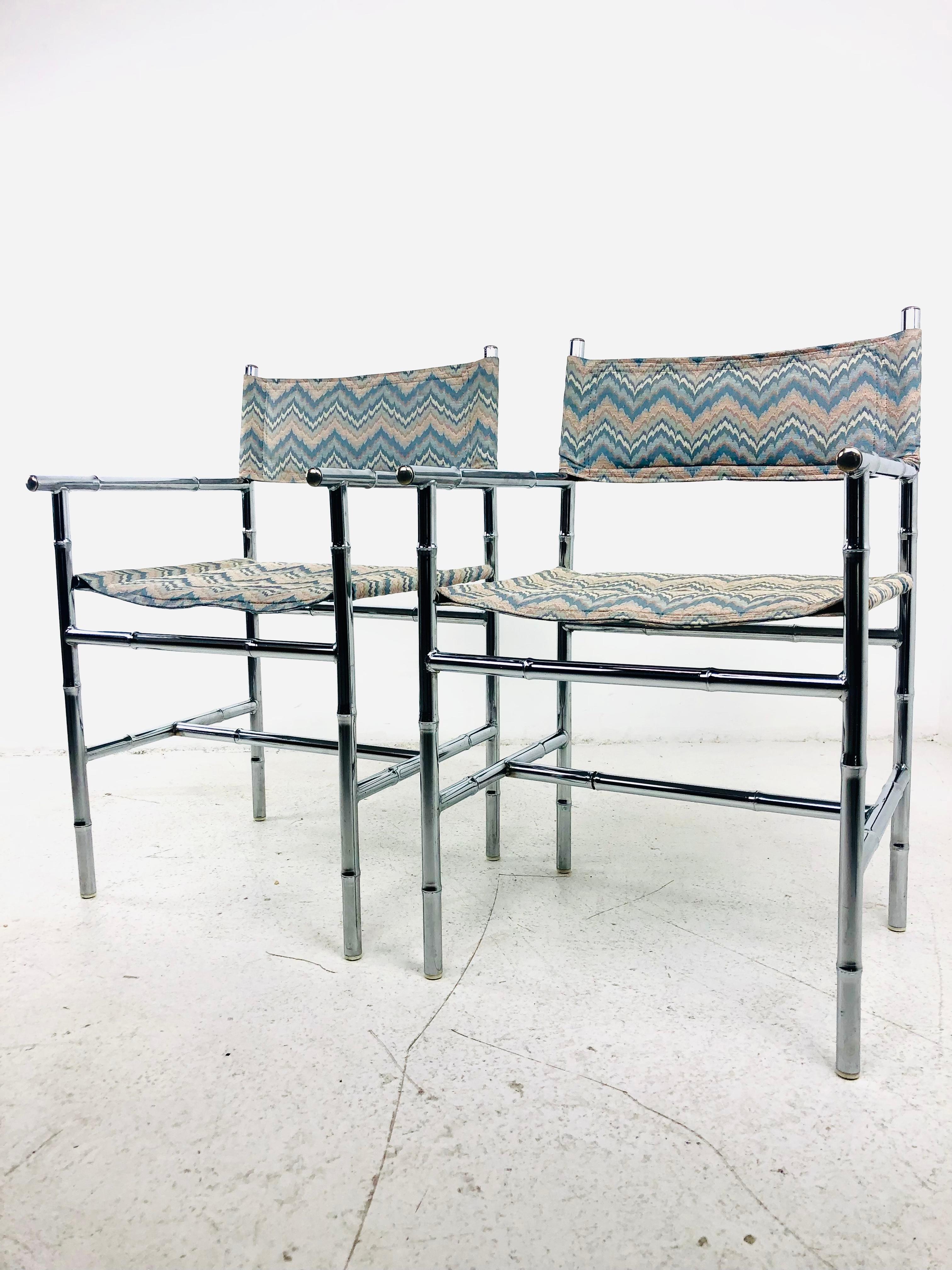 Pair of vintage armchairs with chrome faux bamboo frames. Fabulous original flame stitch upholstery. Good vintage condition with normal wear from age and use; some light pitting to chrome, pictured. 
Seat Height: 16.75 in. Seat Depth: 16 in.