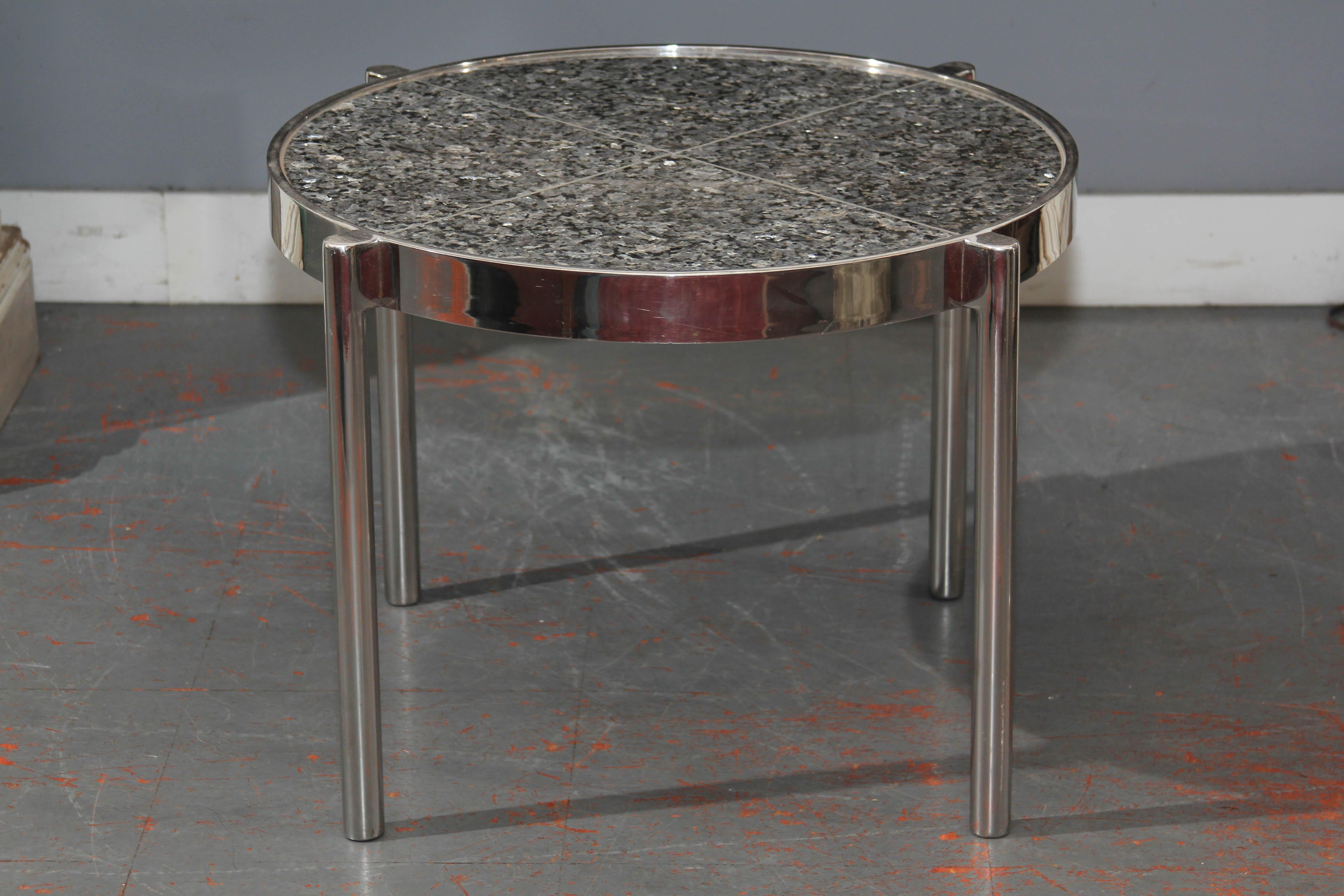 Pair of side tables with chromed frame with a quadrant granite top with chrome 