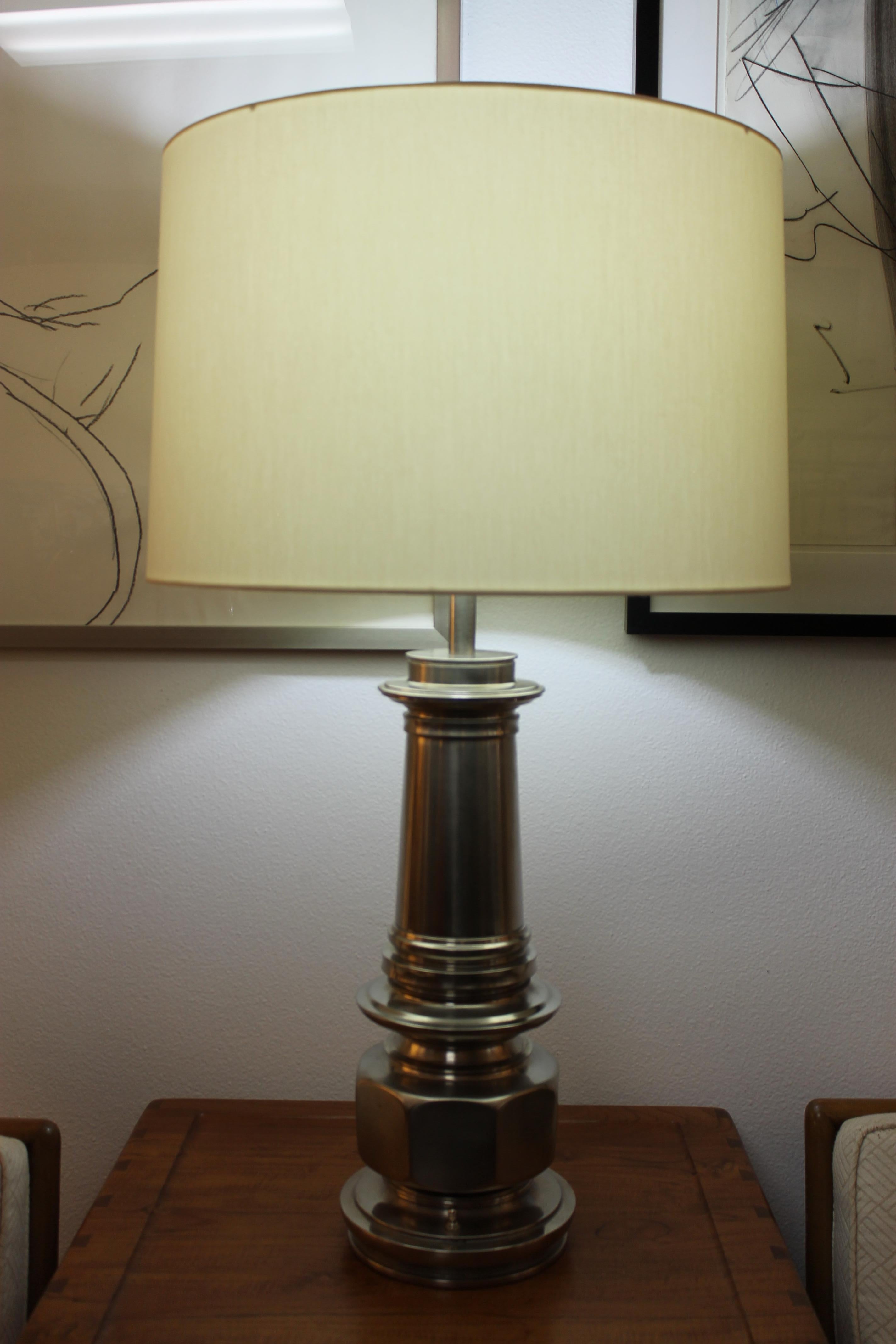Pair of chrome Stiffel lamps. These lamps were originally antique brass and we decided to redo them in a nickel finish. Great looking and heavy. They still have the finials which are a Stiffel trademark. Measures: Base is 7.5