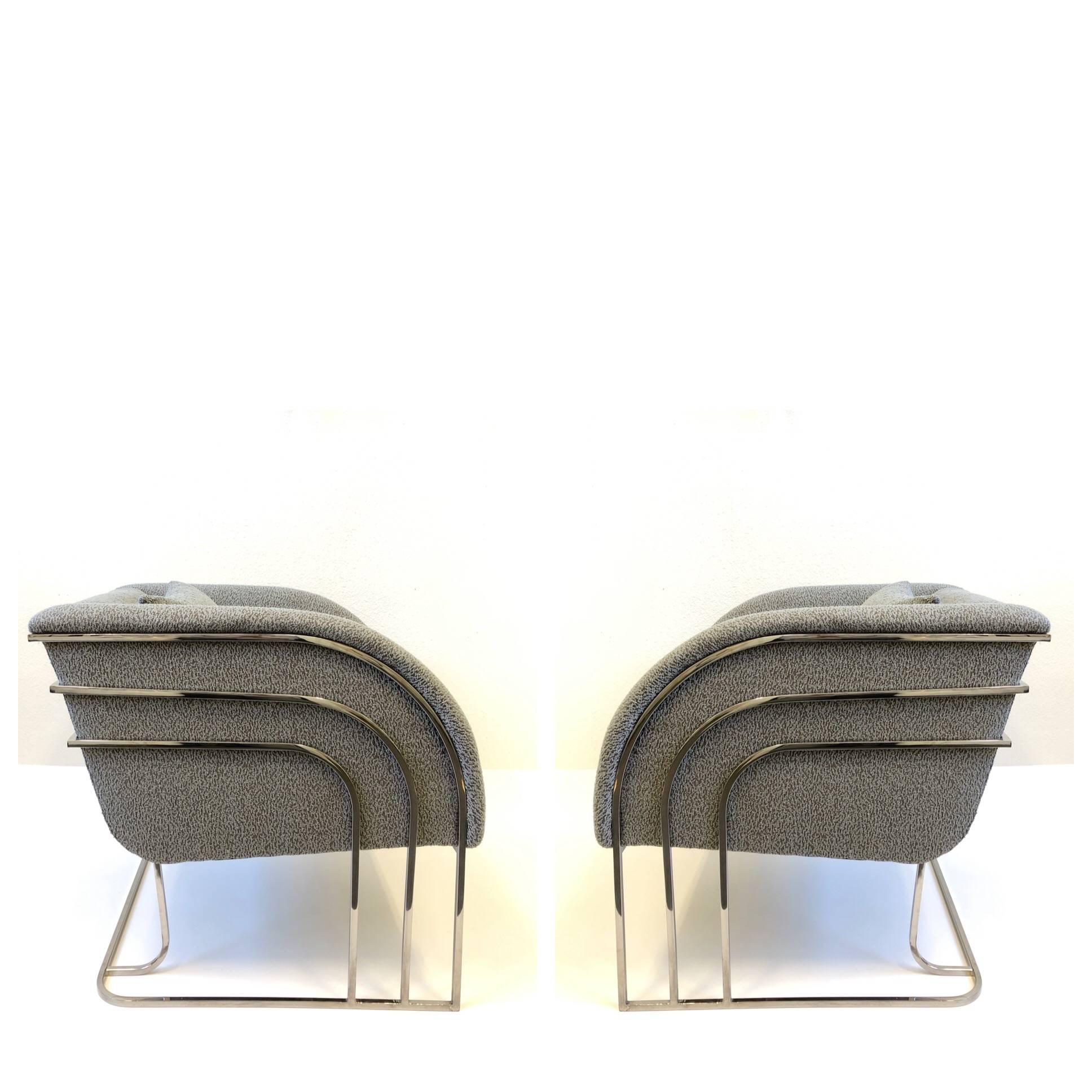 A Rare glamorous pair of polish chrome and fabric lounge chairs. Designed in the 1970s by George Mergenov for Weiman/Warren Lloyd. Newly recovered with a gray nubby fabric (see detail photos)

Dimension: 27” high 27” wide 28” deep 19” seat.