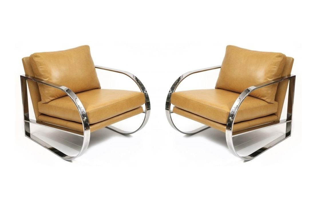 Geometric form lounge chairs designed by John Mascheroni for Swaim originals. Cantilevered chairs featuring flat banded chrome frames, newly upholstered in camel colored leatherette.