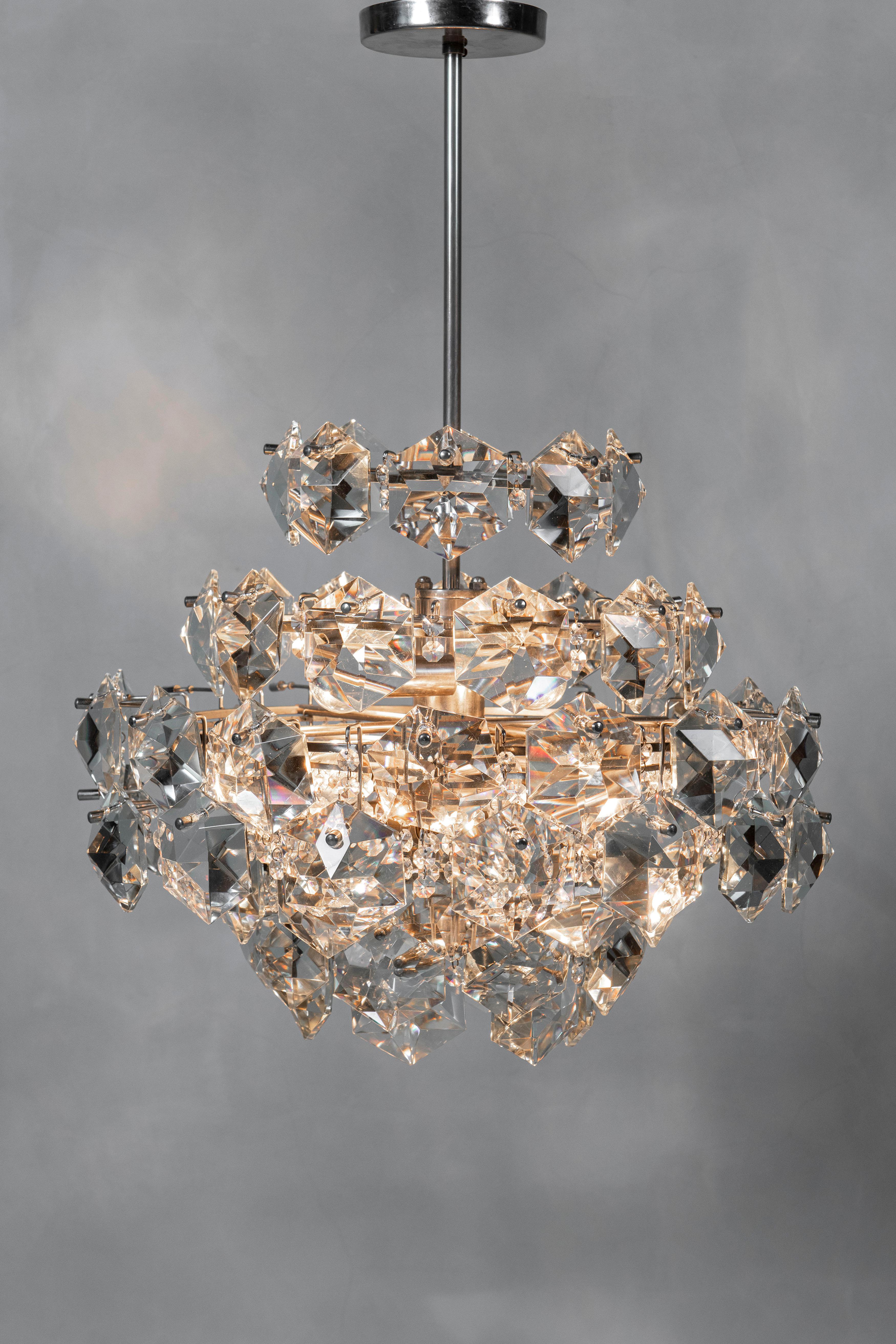 Pair of Chrome metal and crystal glass chandeliers attributed to Bakalowits & Söhne, circa 1960.