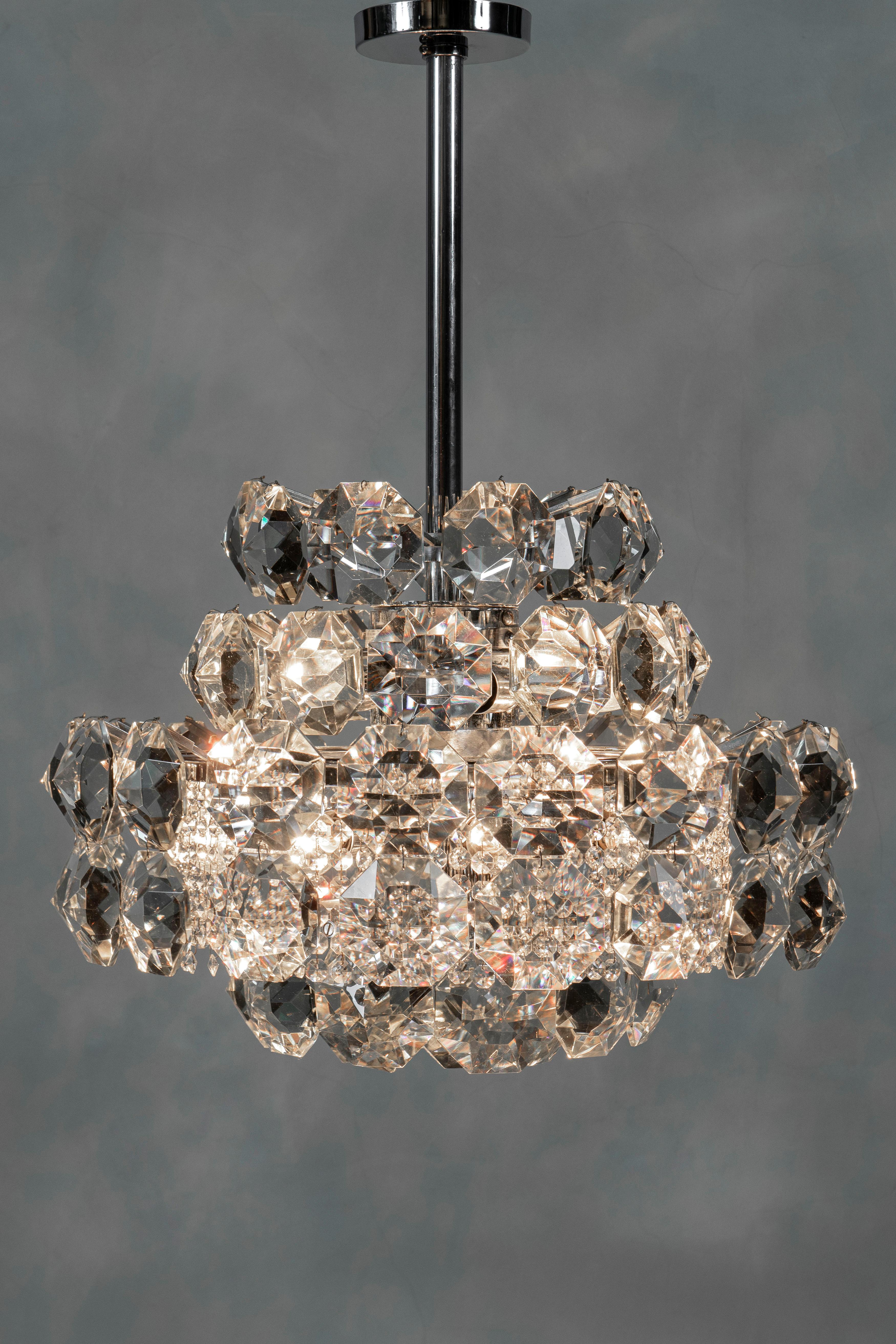 Pair of Chrome metal and crystal glass chandeliers attributed to Bakalowits & Söhne, circa 1960.