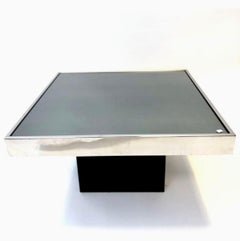 Pair of chrome/mirror glass low tables designed by Maria Pergay, France 1970s