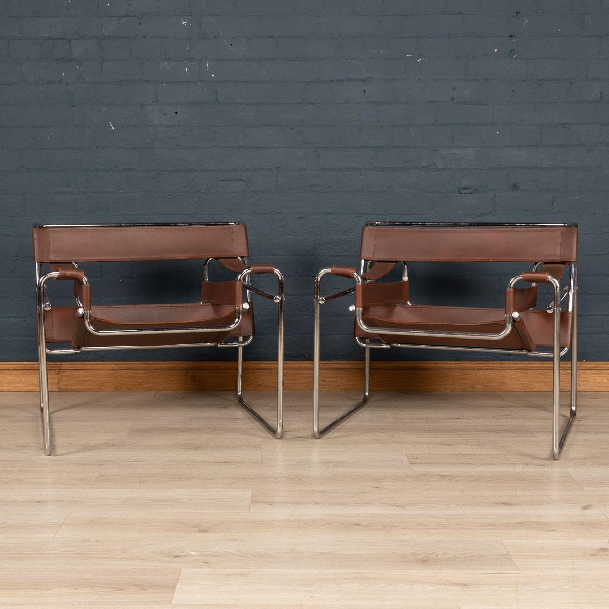 A lovely pair of Wassily armchairs in leather and chrome plated frames. These chairs produced by Knoll are replicas of the original of the iconic Wassily chair, also known as Model B3. The chairs were designed in 1925–1926 by Marcel Breuer while he