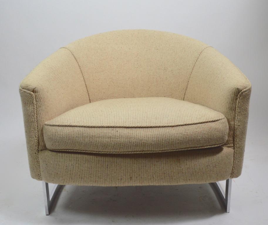 Very stylish pair of lounge chairs with exposed chrome strap frames and tweed upholstered seats and backs. Extremely well constructed, in very good original condition, upholstery shows some light wear, normal and consistent with age. Usable as is,