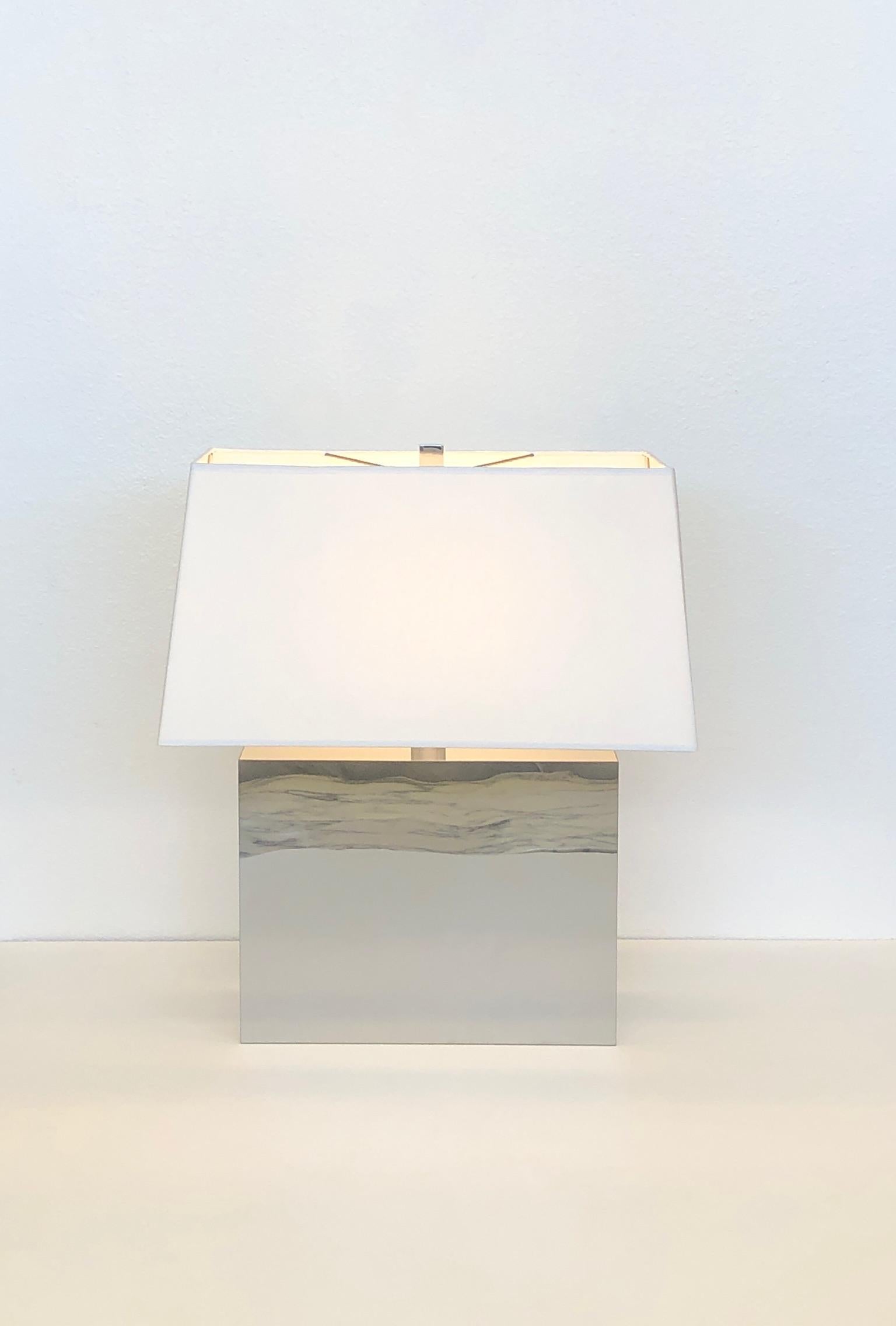 Pair of chrome and off white shades table lamps by George Kovacs from the 1970’s. 
Newly rewired and new shades.
In beautiful vintage condition shows minor wear consistent with age. 
Hard to photograph the lite surface scratches. 
Overall