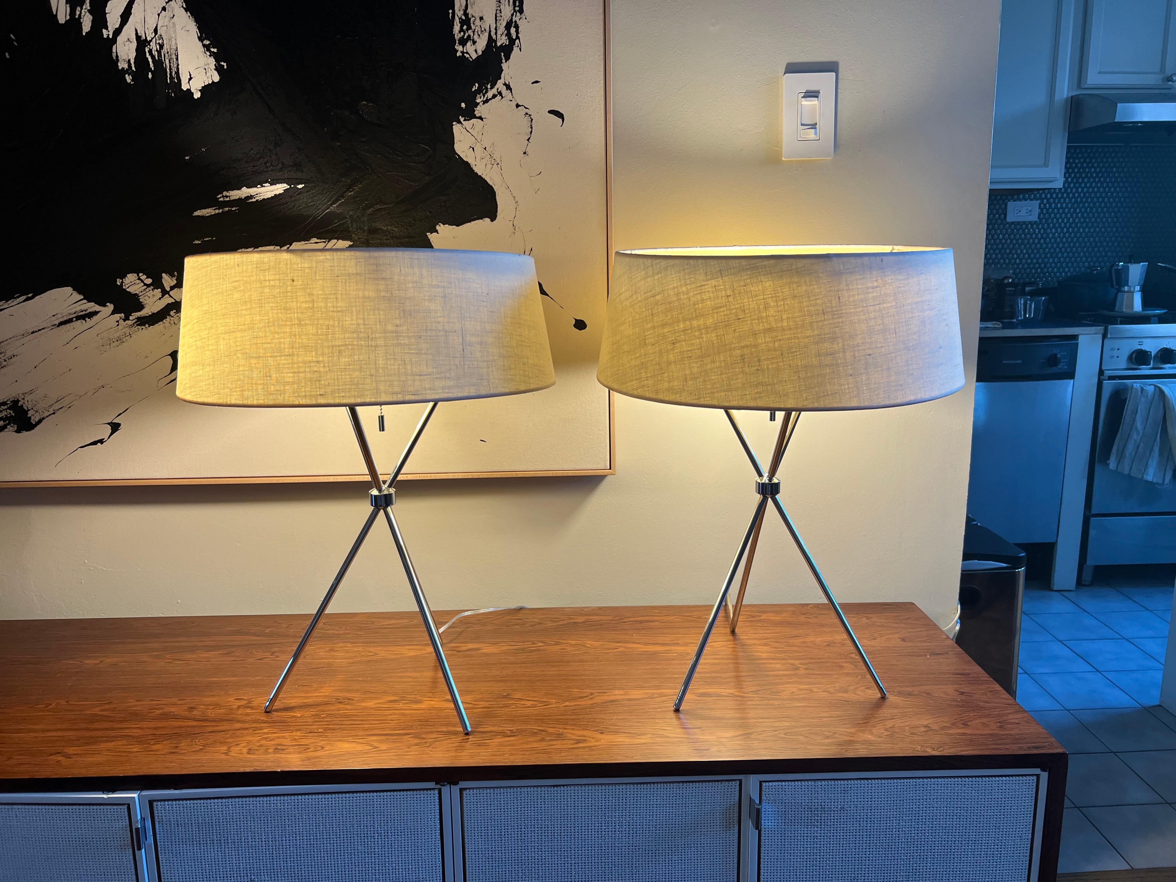 Pair of tripod table lamps model no. 170 in brass with 3 bulbs and shade by T.H. Robsjohn-Gibbings for Hansen Lighting, American 1960s. Original shades and wiring.  Price is for the pair.
