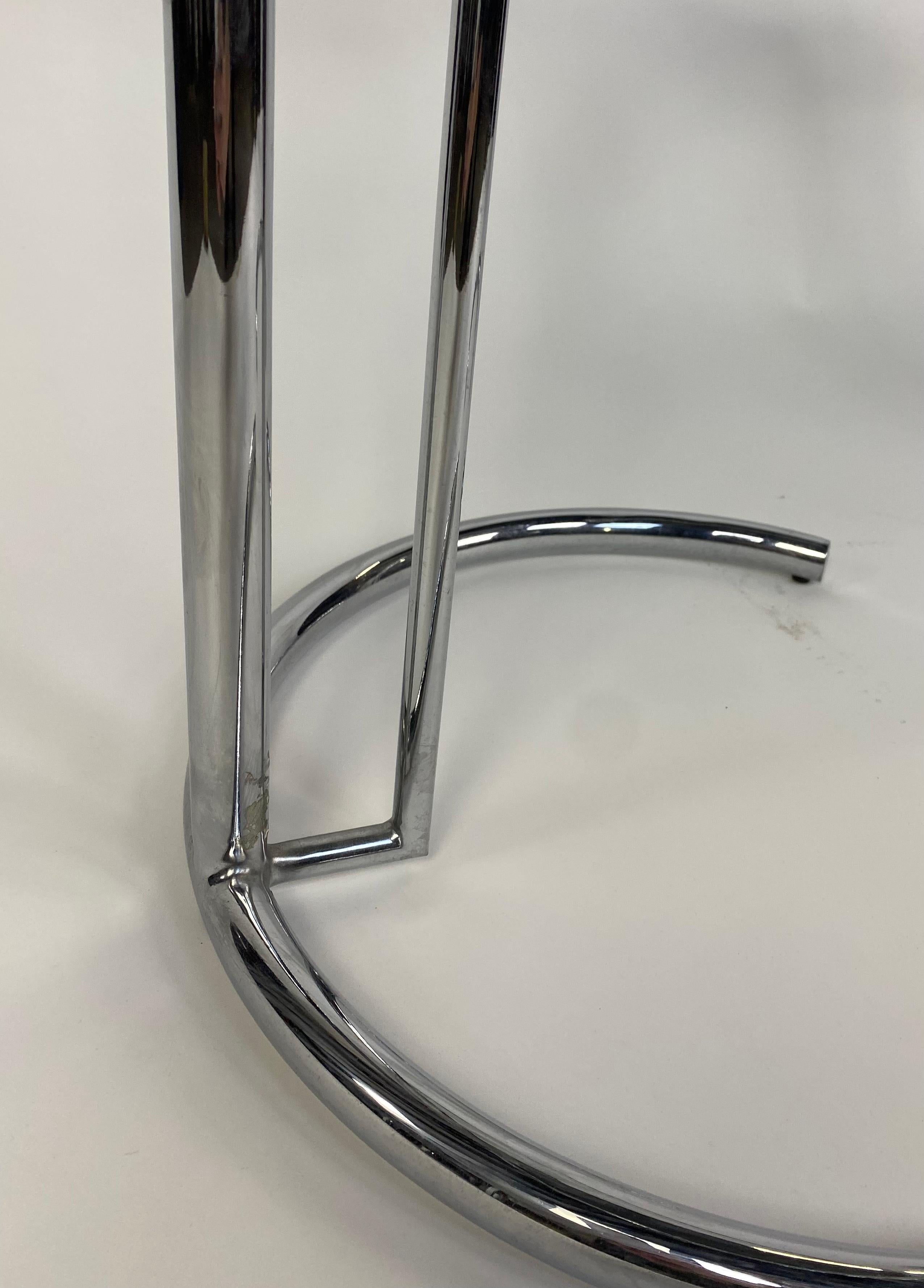 Glass Pair of Chrome Tube Adjustable Height End Tables in the Style of Eileen Gray